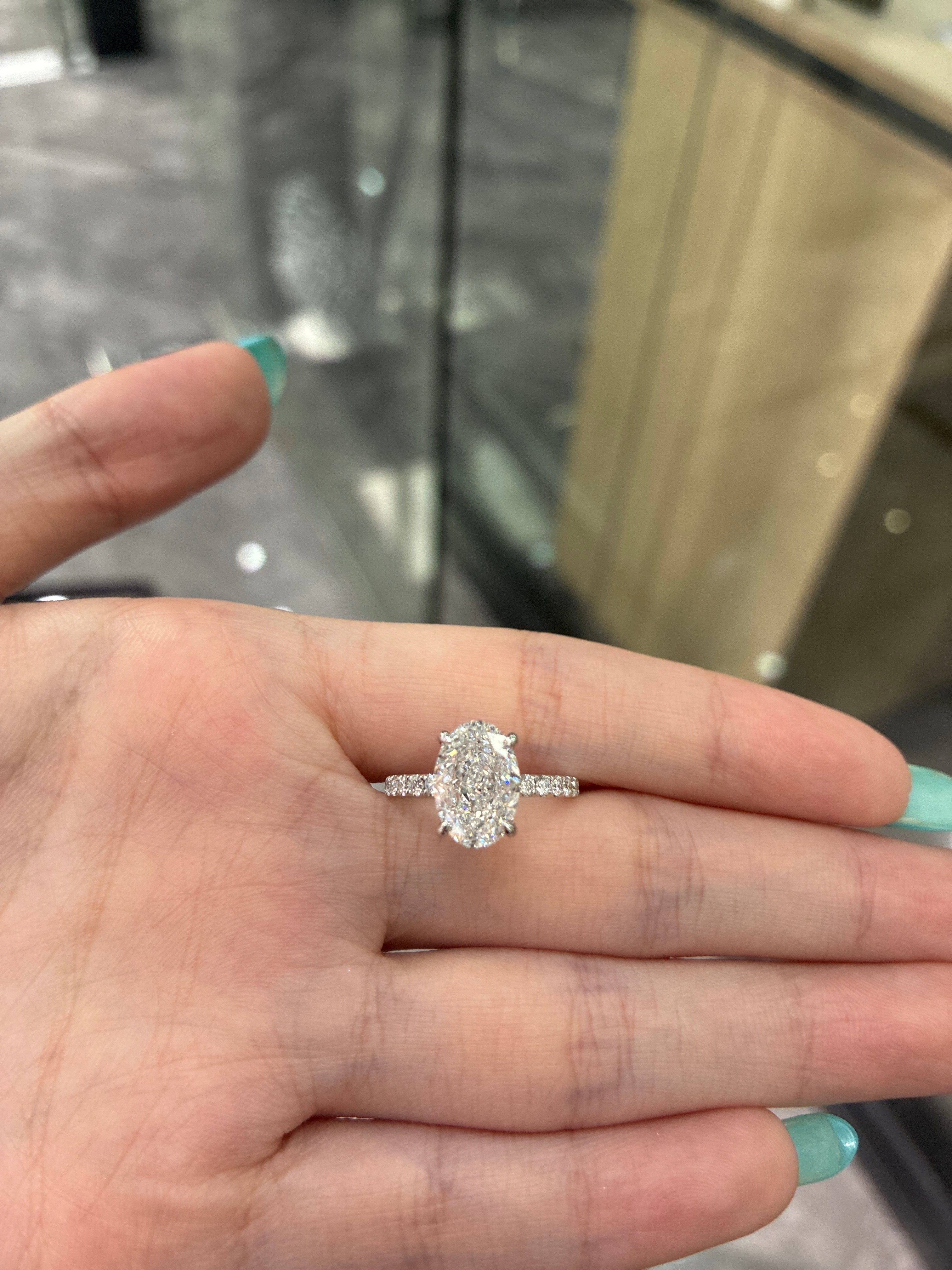 For Megan IVancin 18K white gold 3.10ct oval DVS1 with 0.345 side stones