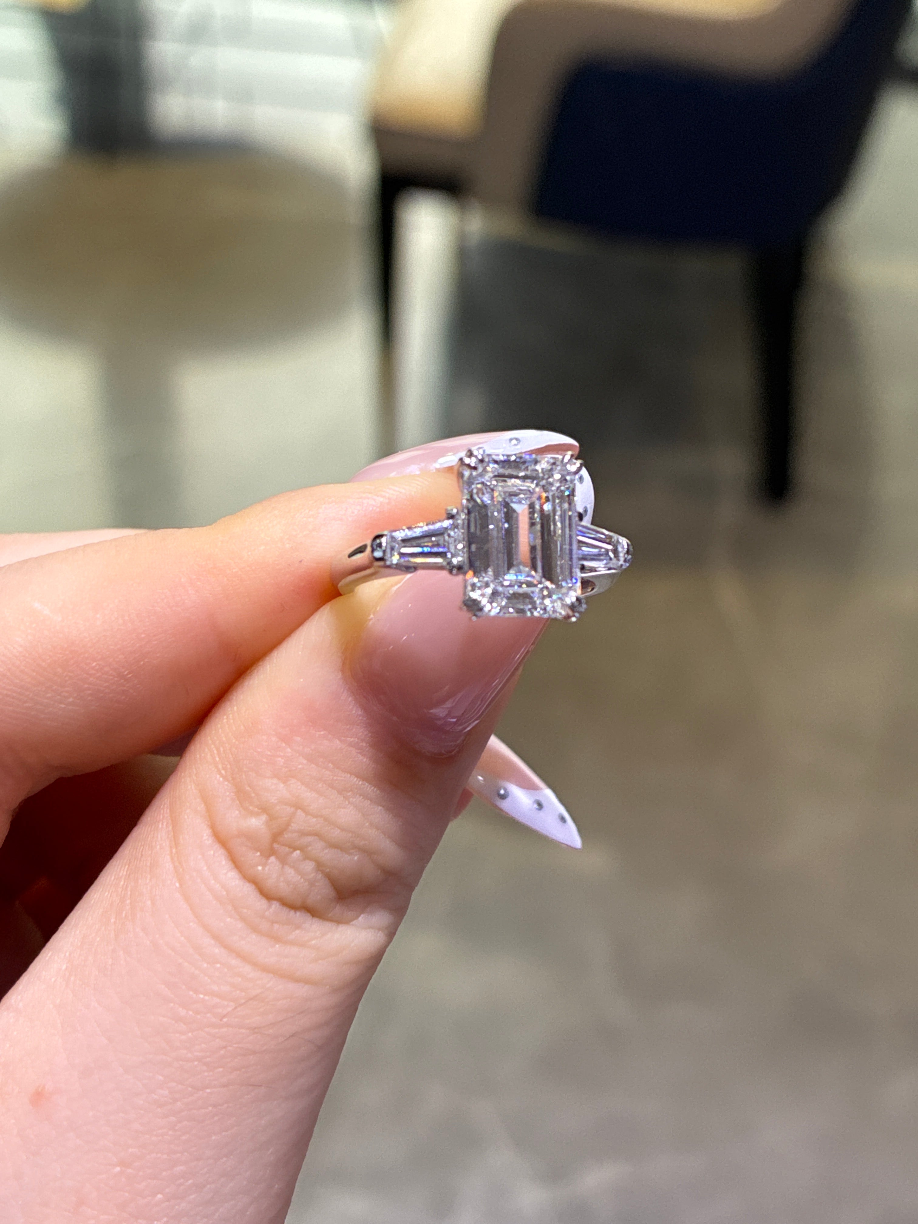 For chris platinum E/vs1 emerald cut 3.45ct side stone 0.497ct