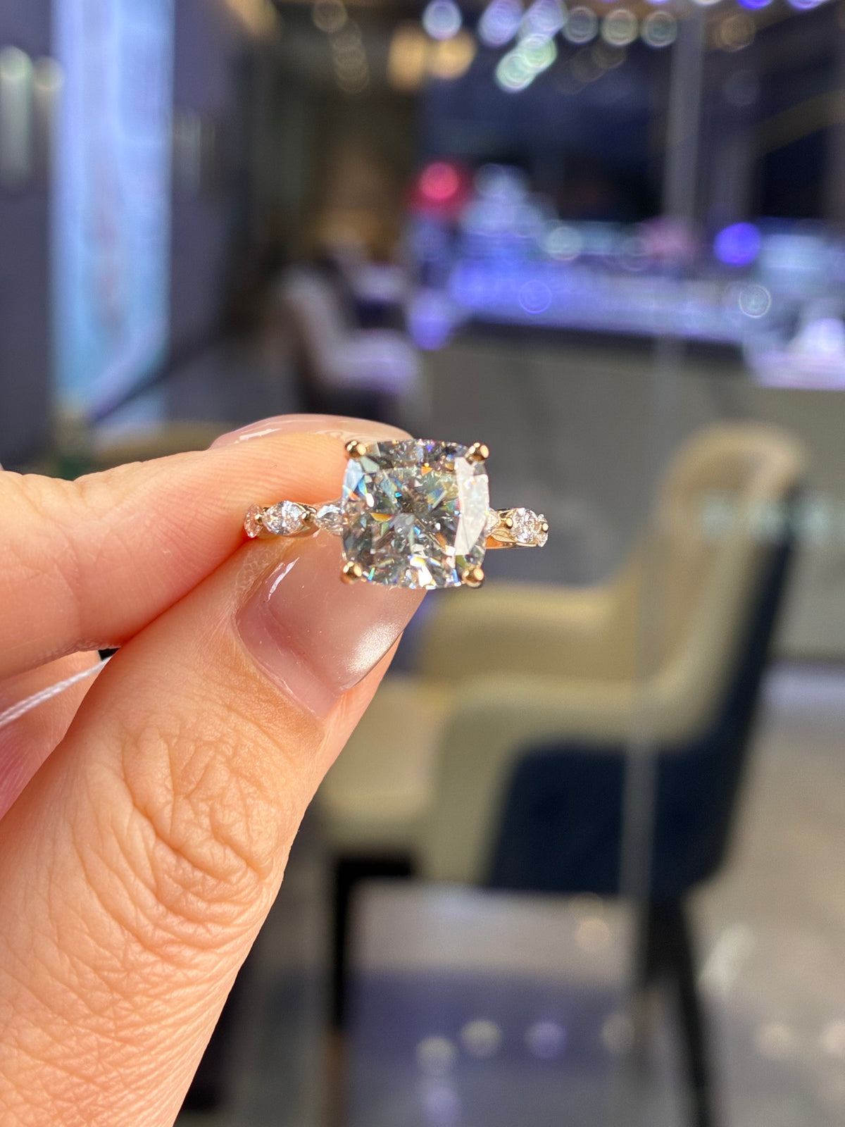 For Jeanie 14K yellow gold, with a 4.090ct cushion-cut center diamond and 0.659ct total side diamonds, E color, VVS2 clarity.