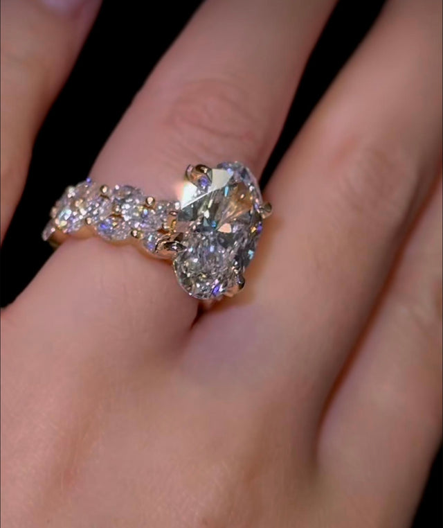 (Deposit )Custom order for Haley:
• 14K yellow gold ring with a 3.0 ct Moval diamond, 2:10 ratio, EF/VS1
• Two 14K gold half-eternity marquise diamond bands