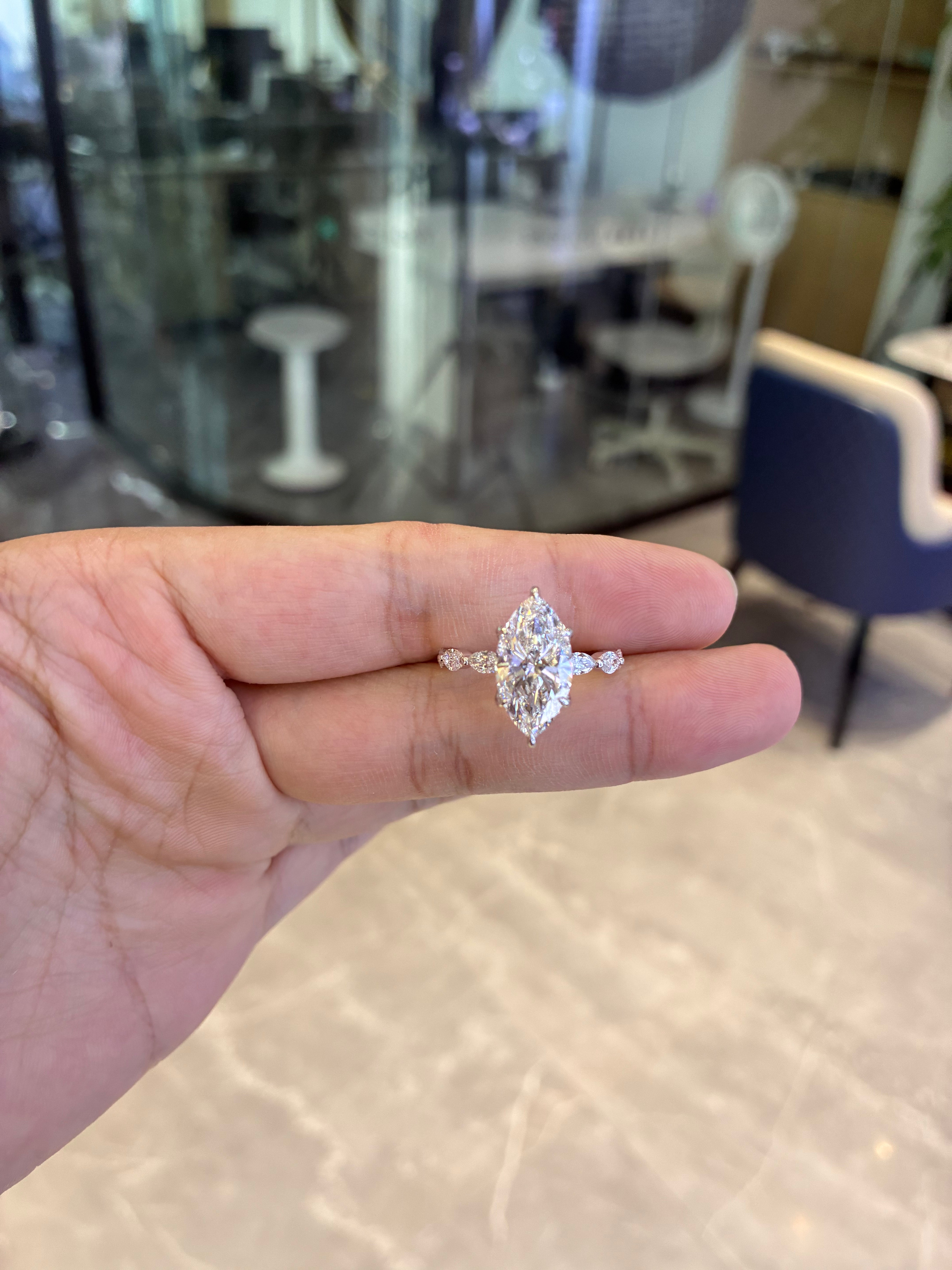 For Mo 14k white gold ring with 4ct marquise diamond And 0.9ct side stones