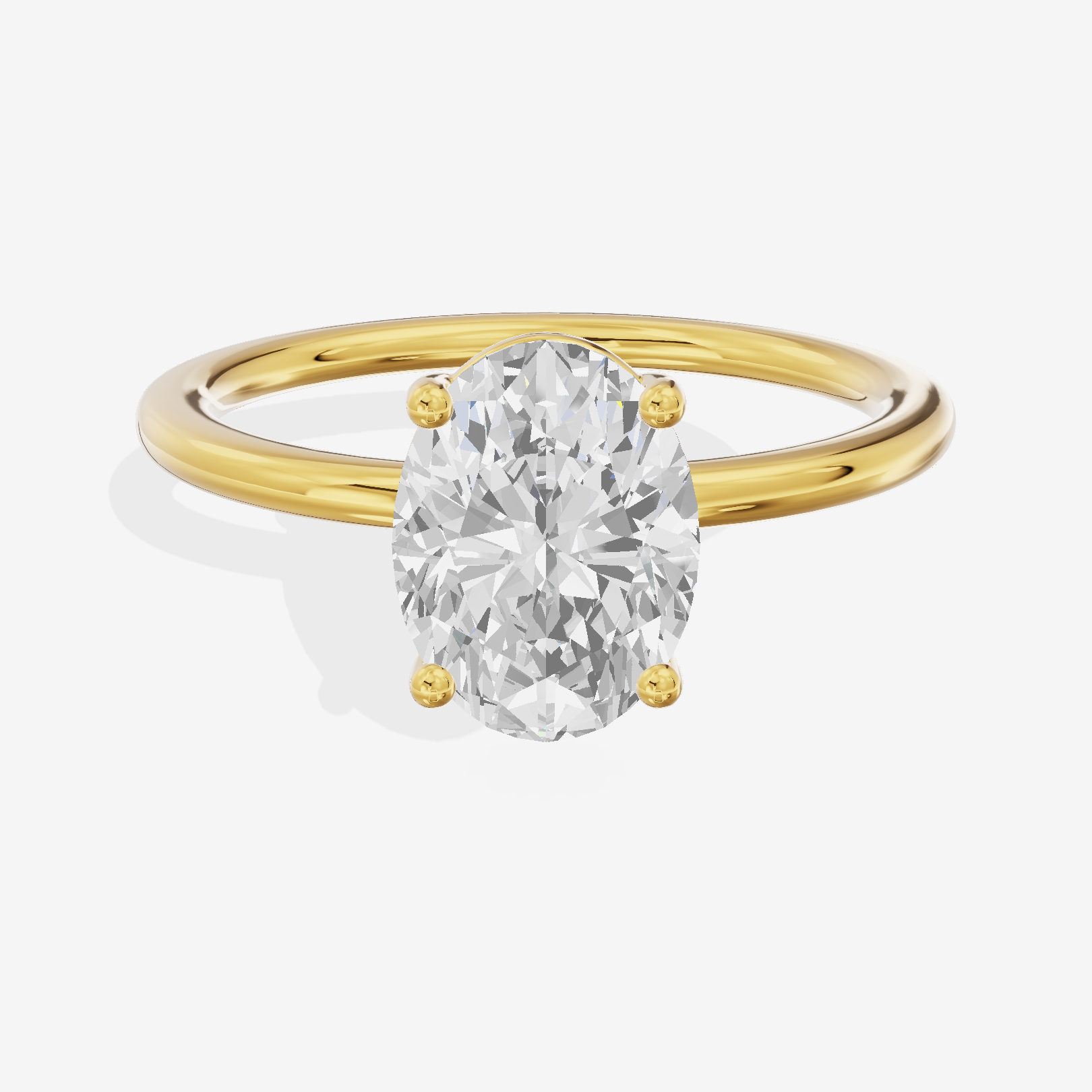 Crowned Vowsae 1.5mm Oval Solitaire Engagement Ring in 18K Yellow Gold