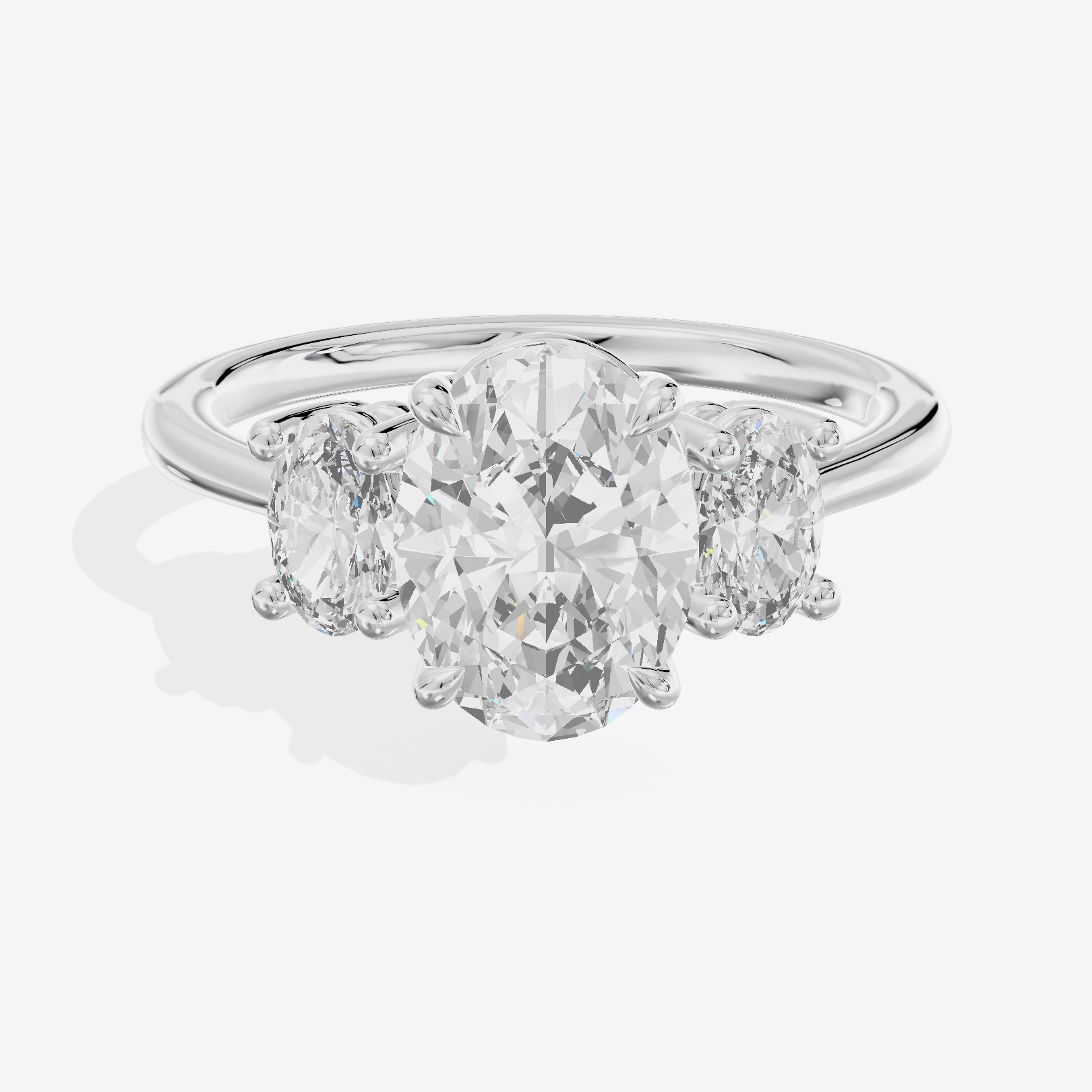 Modern Coeurine Three Stone Oval Engagement Ring (1/2 ct. tw.) in 18K White Gold