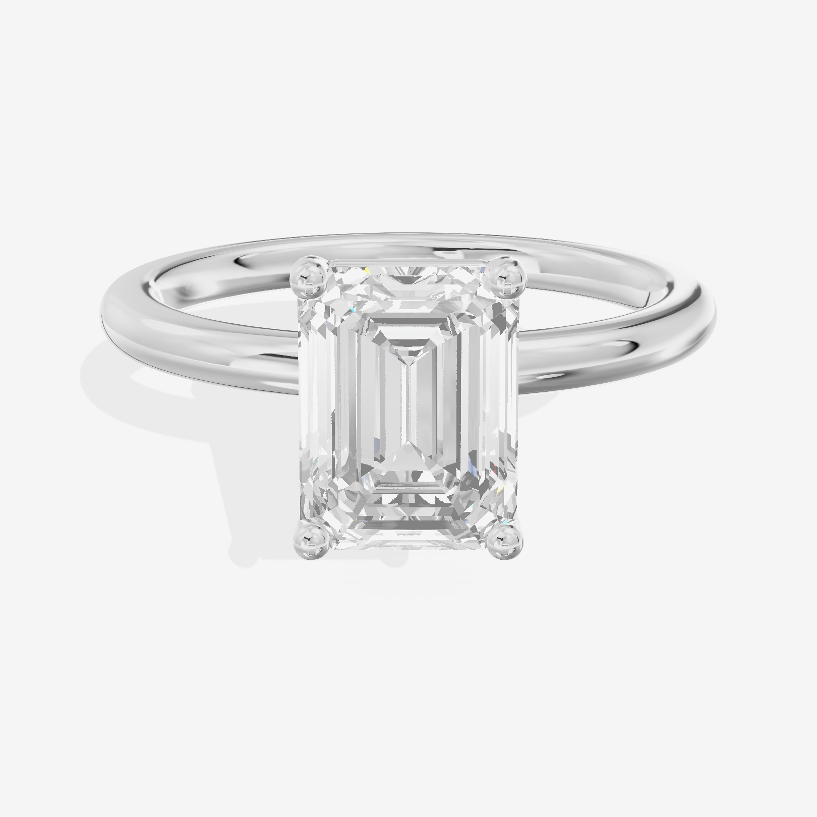 Tender 2mm Emerald Solitaire Engagement Ring in 14K White Gold
