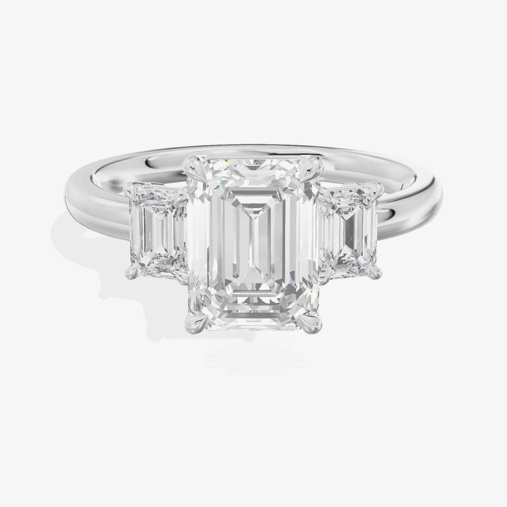Petite Coeurine Three Stone Emerald Engagement Ring (1/5 ct. tw.) in Platinum