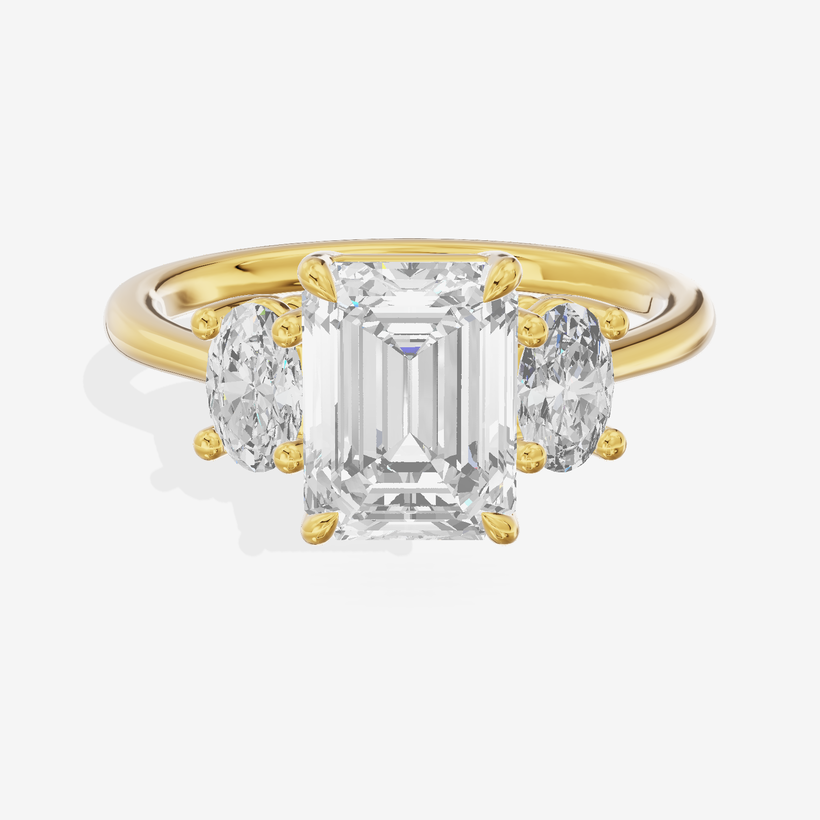 Modern Coeurine Three Stone Emerald Engagement Ring (1/2 ct. tw.) in 18K Yellow Gold