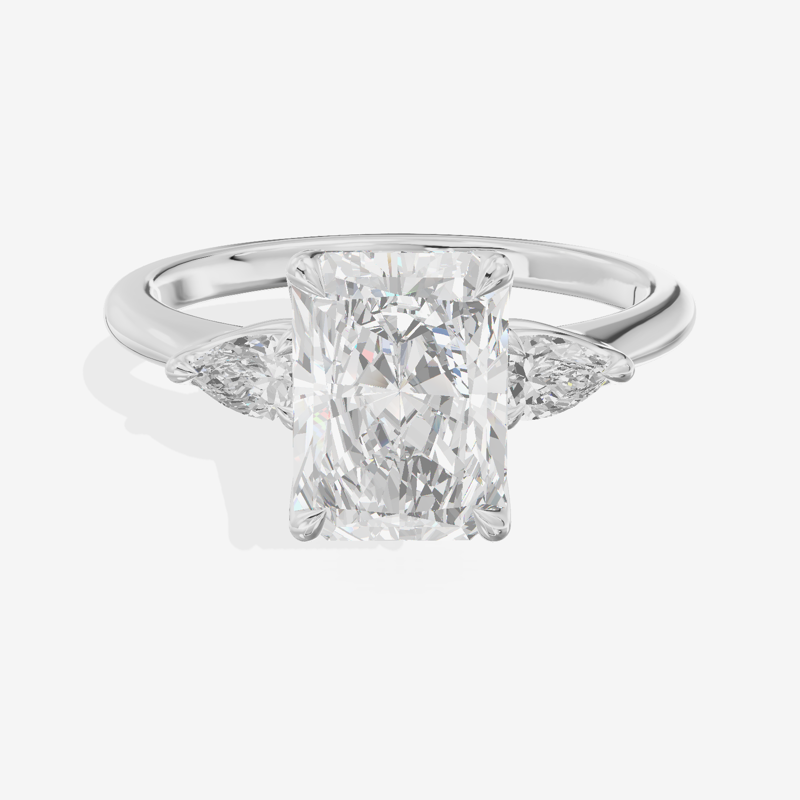 Petite Coeurine Three Stone Radiant Engagement Ring (1/5 ct. tw.) in Platinum