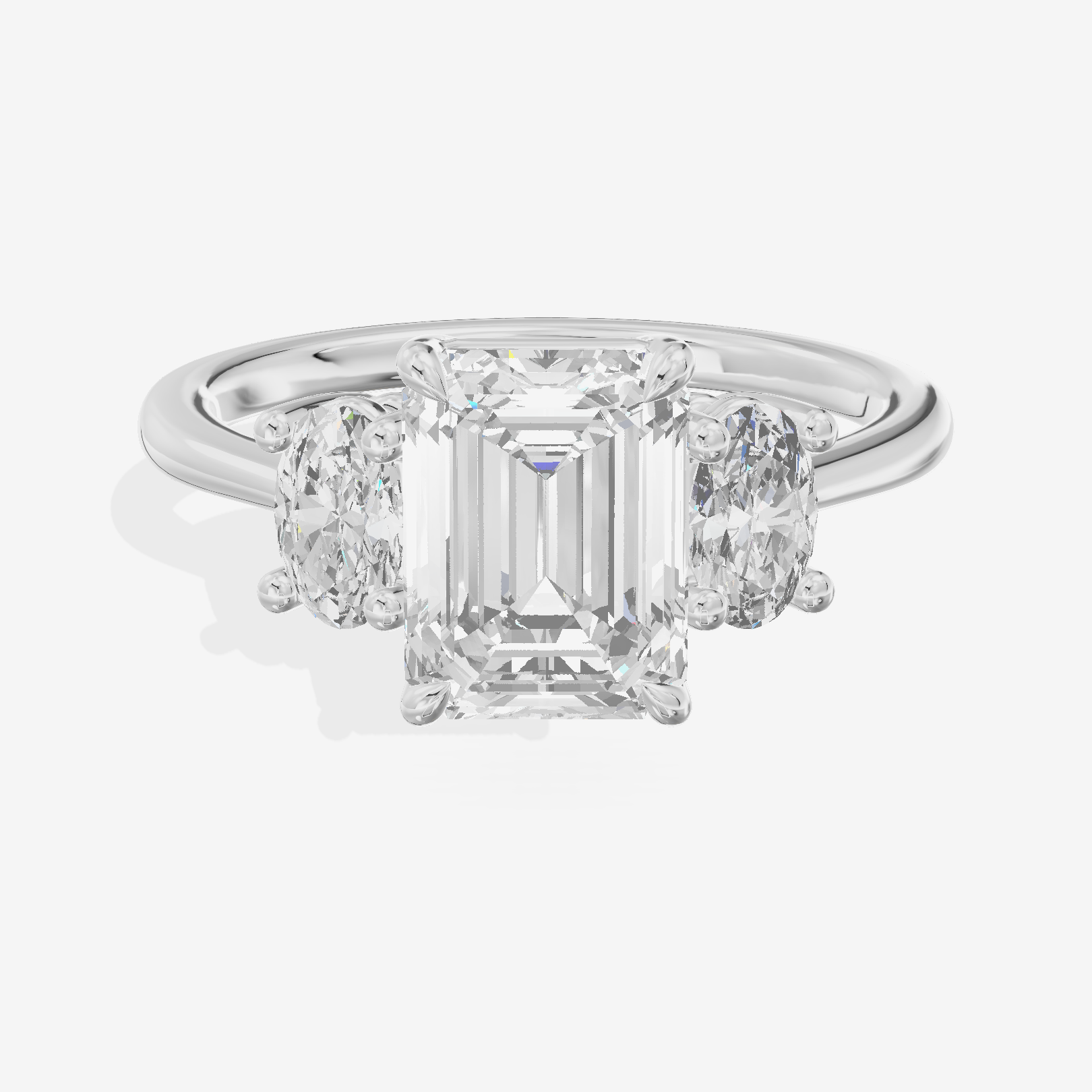Modern Coeurine Three Stone Emerald Engagement Ring (1/2 ct. tw.) in 18K White Gold