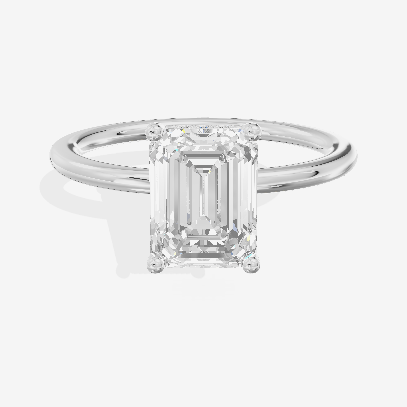 Reverya Hidden Halo Emerald Engagement Ring (1/20 ct. tw.) in 18K White Gold