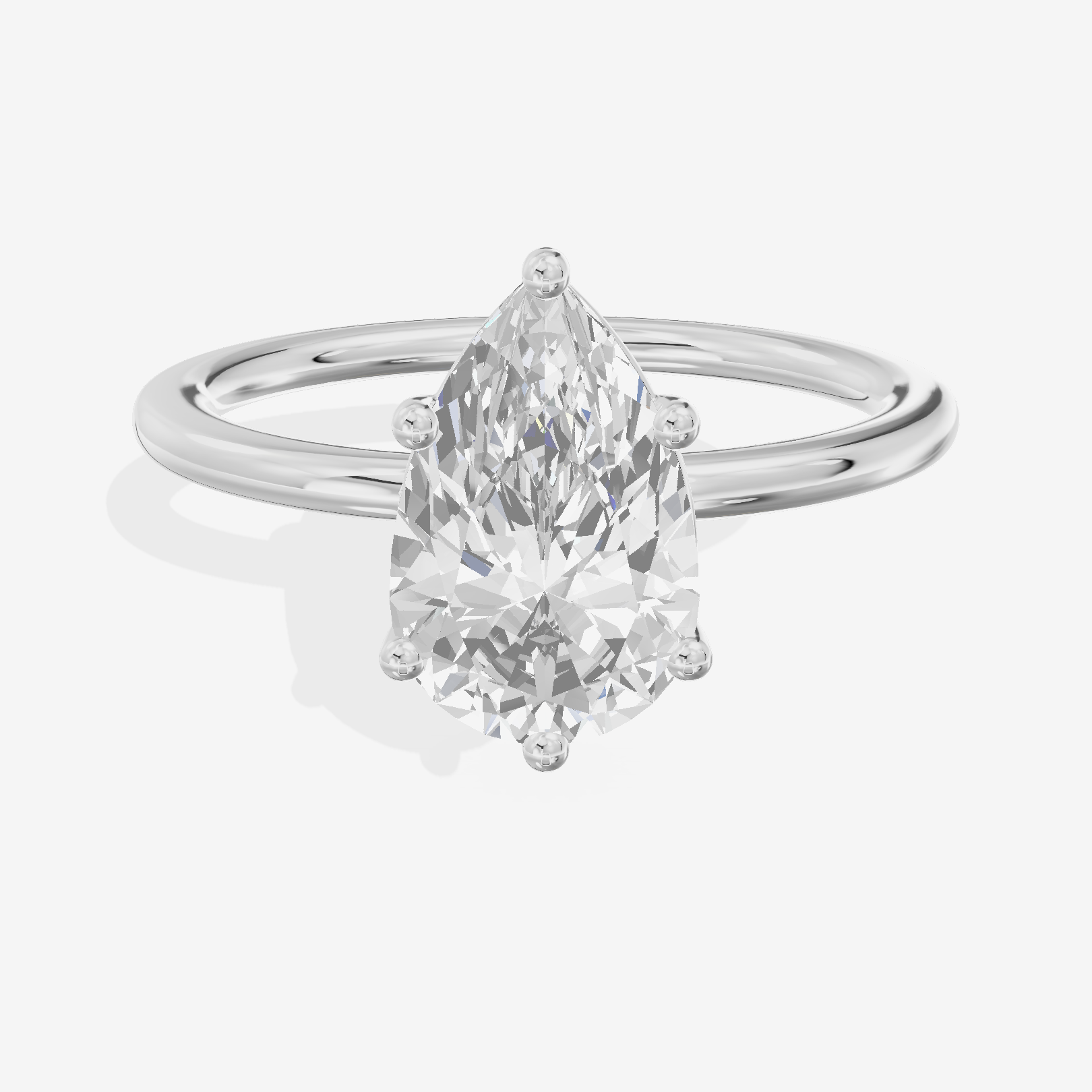 Crowned Vowsae 1.5mm Pear Solitaire Engagement Ring in Platinum