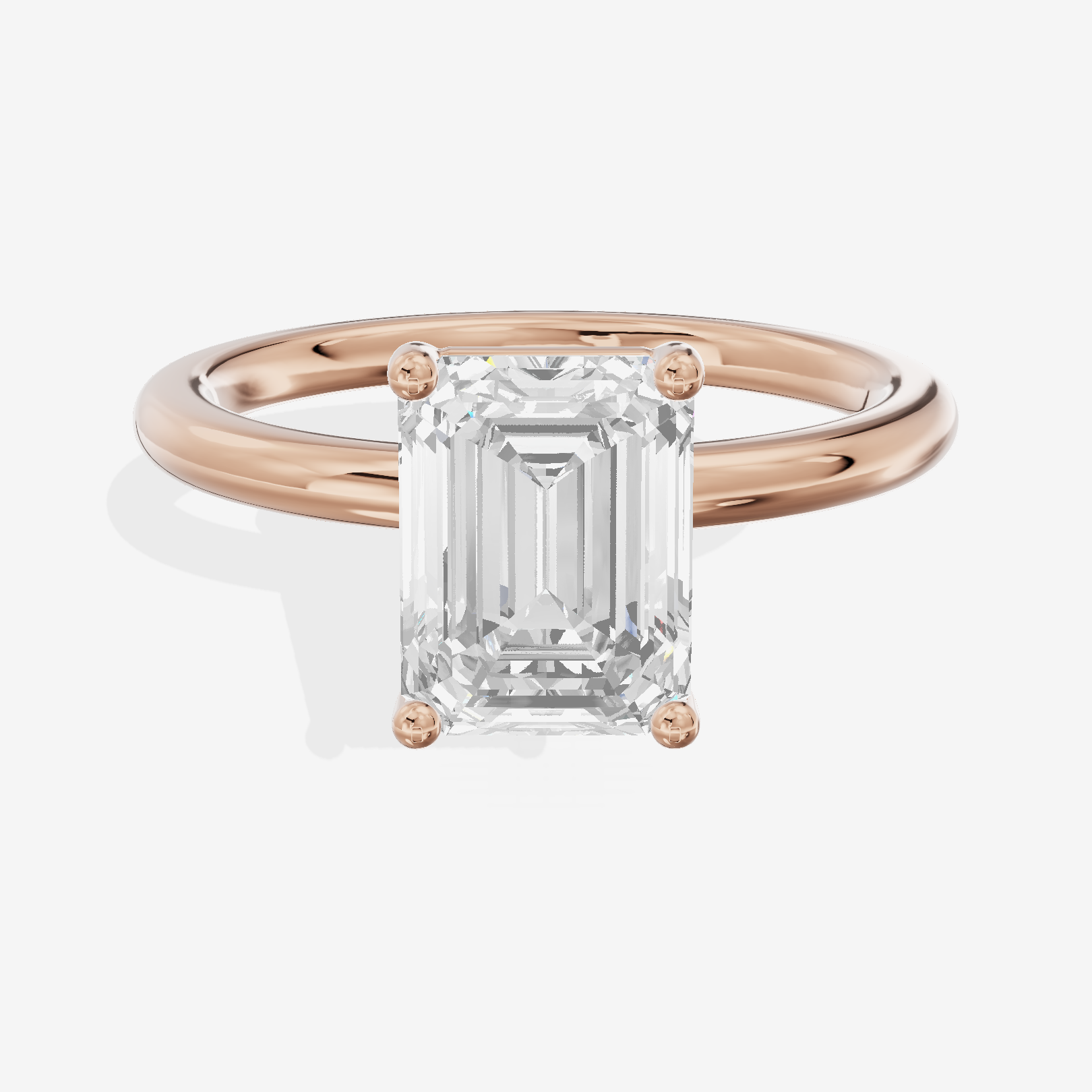 Tender 2mm Emerald Solitaire Engagement Ring in 14K Rose Gold