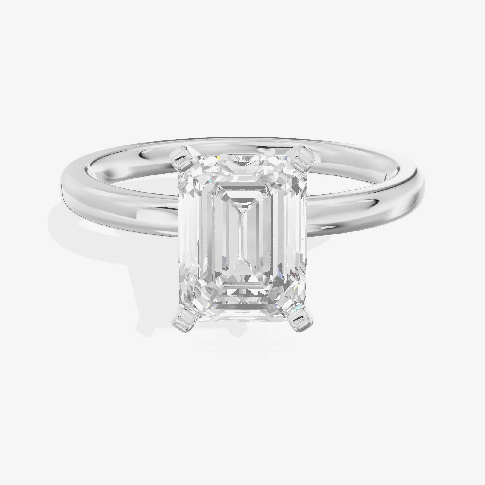 Sincere 2mm Emerald Solitaire Engagement Ring in Platinum