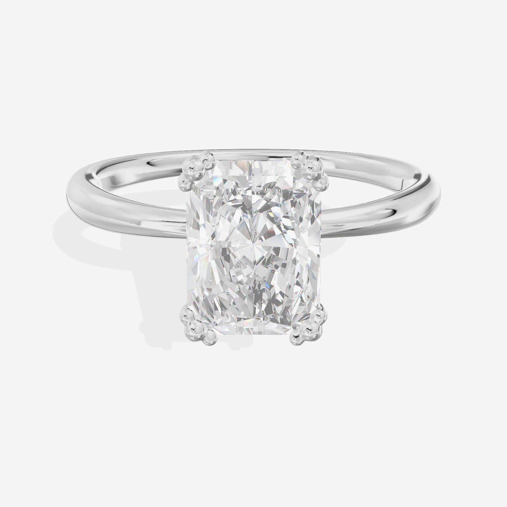 Classic Tender Radiant Solitaire Engagement Ring in 18K White Gold