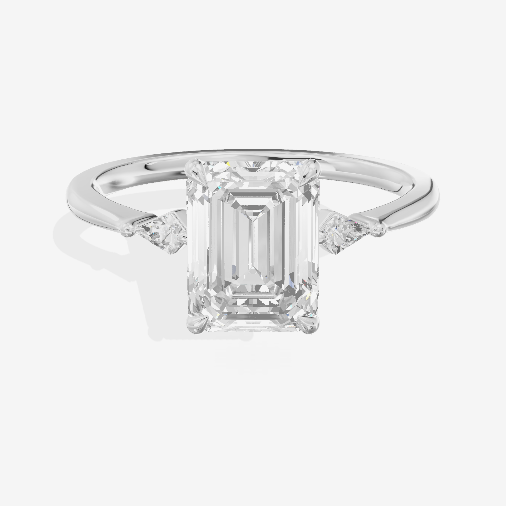 Petite Triade Emerald Three Stone Engagement Ring (1/15 ct. tw.) in Platinum