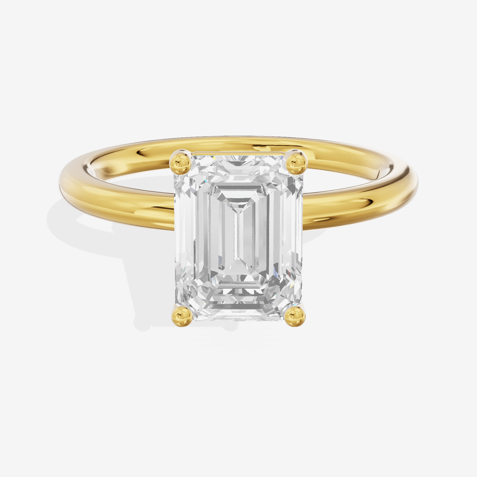 Tender 2mm Emerald Solitaire Engagement Ring in 14K Yellow Gold