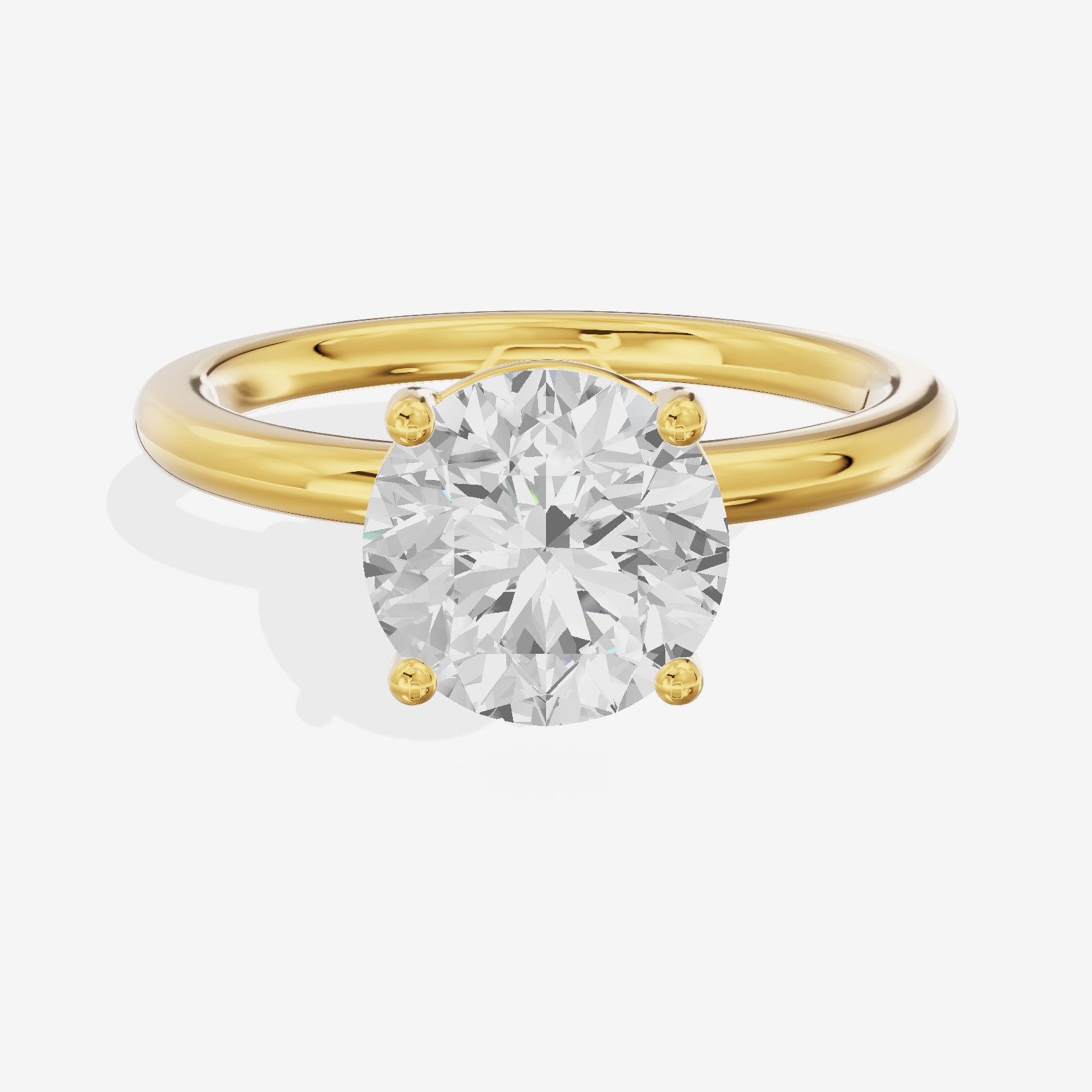 Tender 2mm Round Solitaire Engagement Ring in 14K Yellow Gold