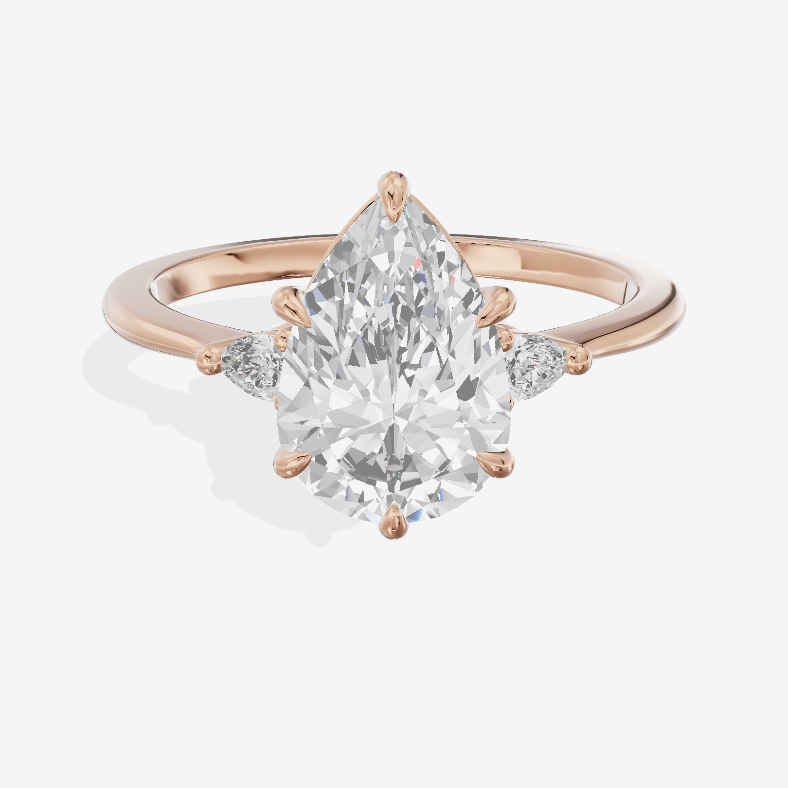 Clusta Three Stone Pear Engagement Ring (1/10 ct. tw.) in 18K Rose Gold