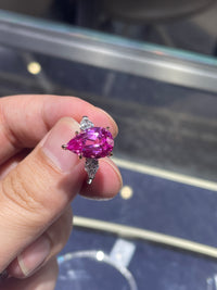 For anabanana three stone style ring two tone 18 k main stone pink sapphire 6.235ct pear cut side stone lab diamond 0.832ct