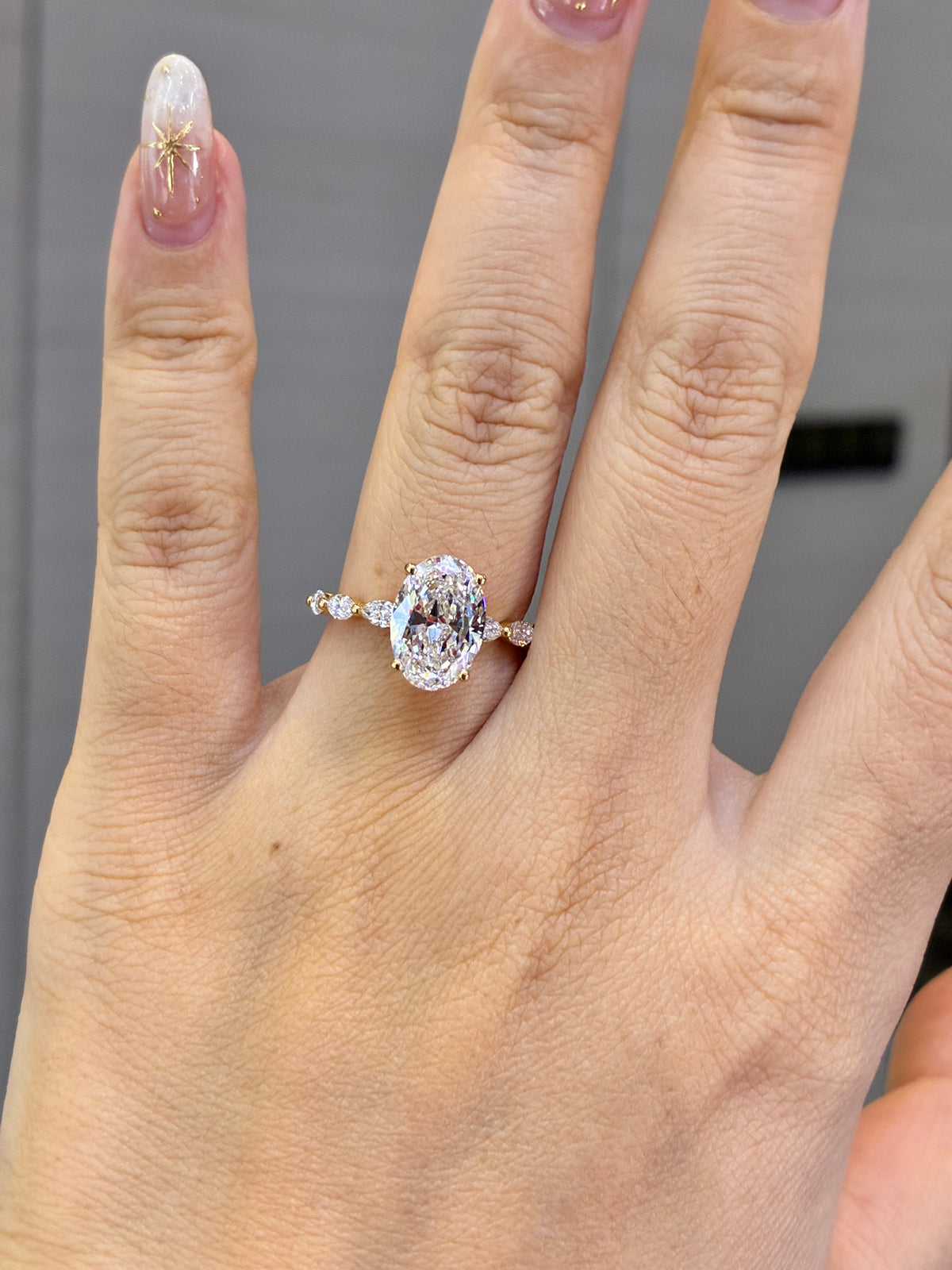 For Luz, 3ct Oval Solitaire with 0.625ct Marquis sidestones in 18k gold