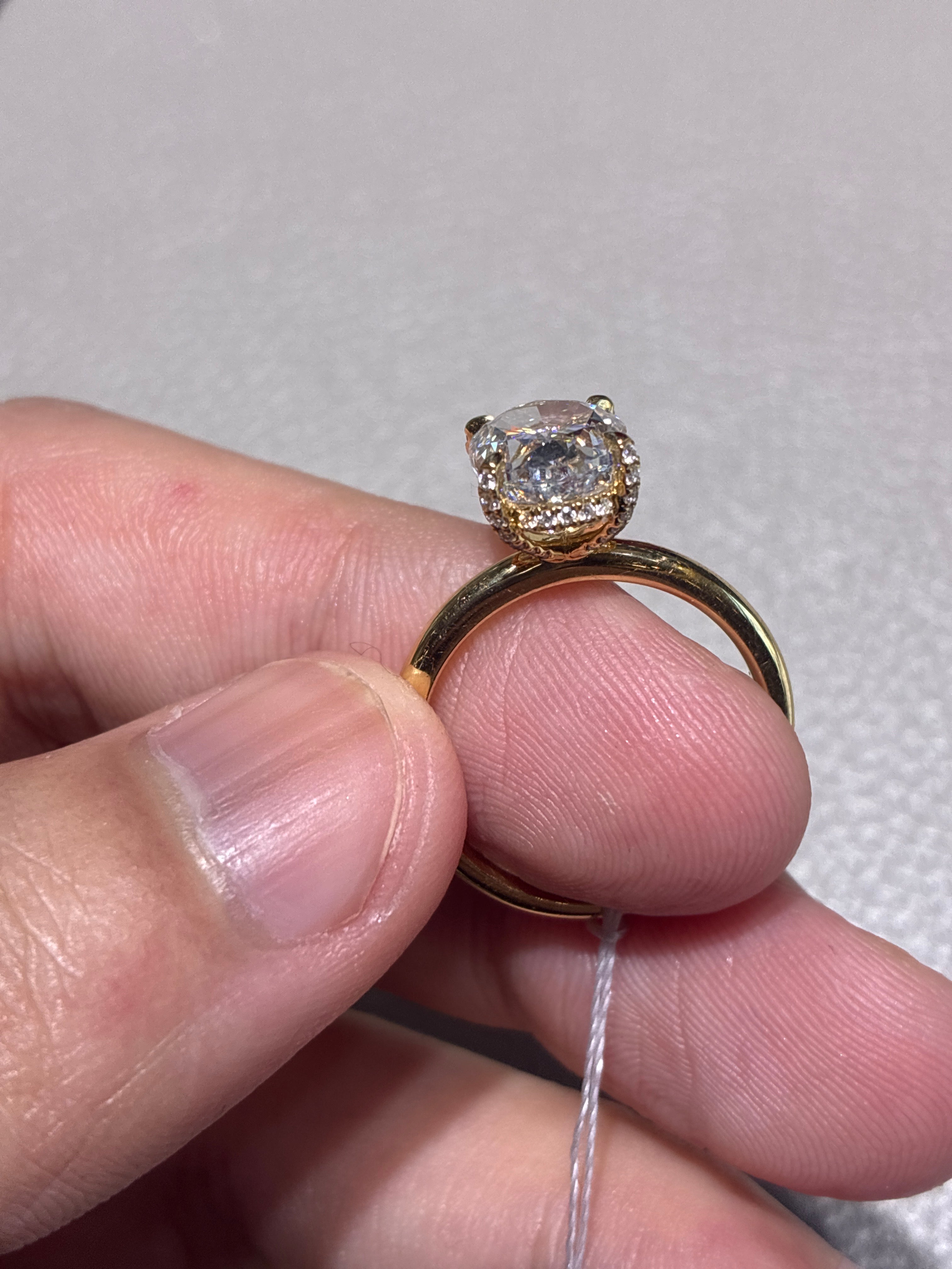 18k gold oval 3.2 carats, hidden halo