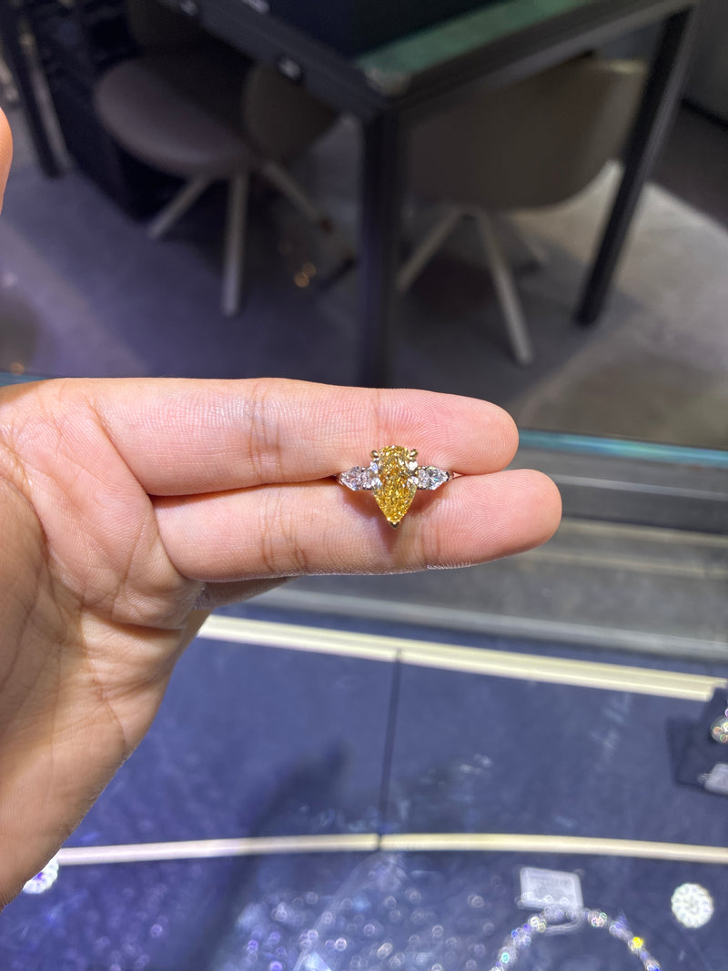 Adding hidden halo For Tammy Sholes230 14k white gold 3stone ring with 2ct pear cut yellow diamond