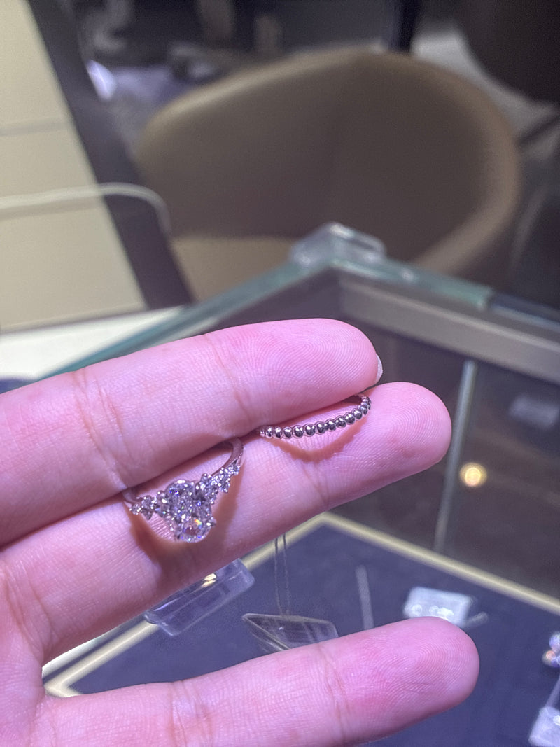 For Renee a set platinum main stone oval cut 2.1ct D/VS1. Side stone 0.224ct and ring 18k white gold