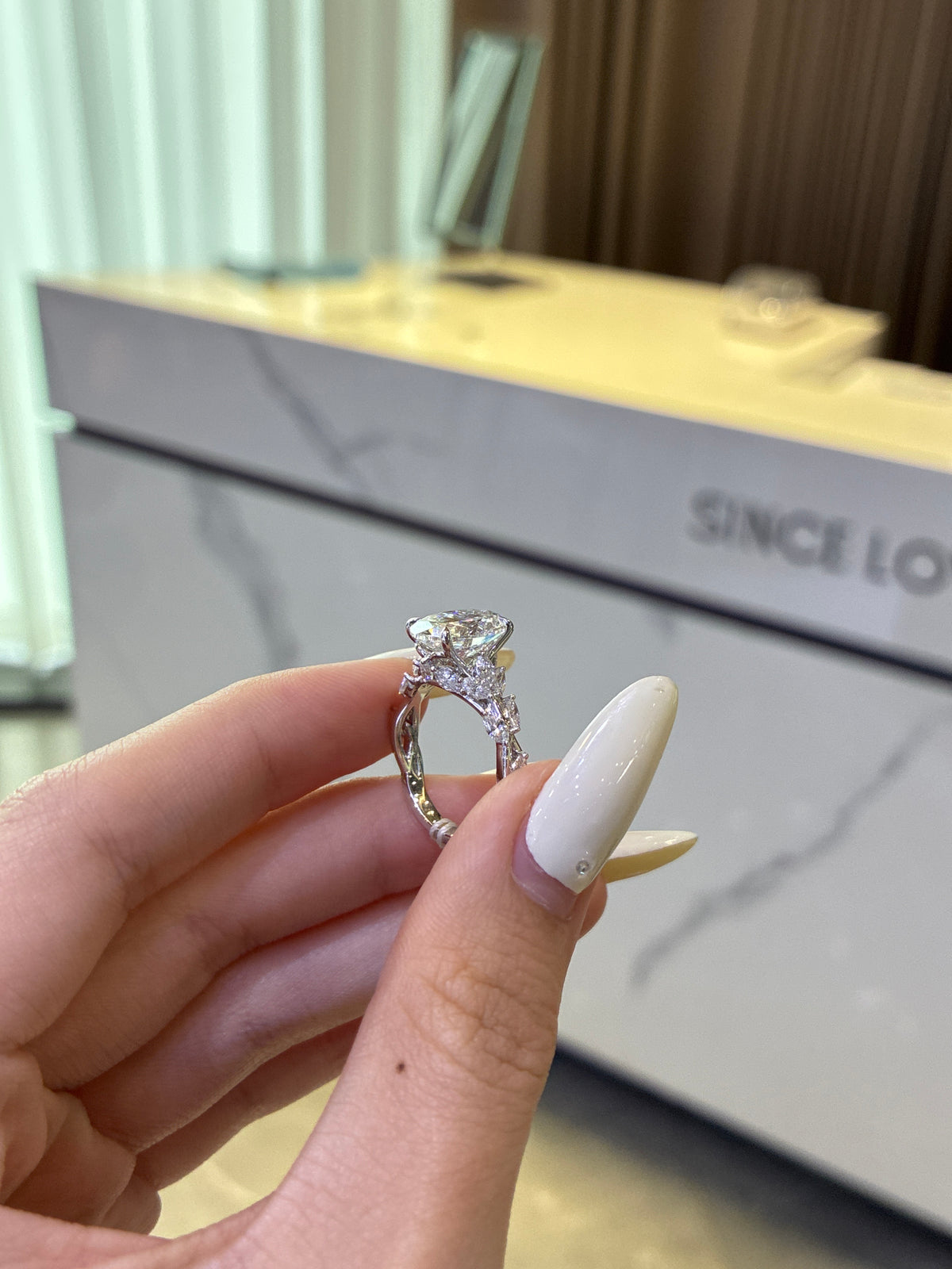 For ElevatedLux, 14k white gold setting only, designed to fit a 4ct radiant loose diamond, the side stones total 0.9ct. All the side stones are D–E color with VS–VVS clarity