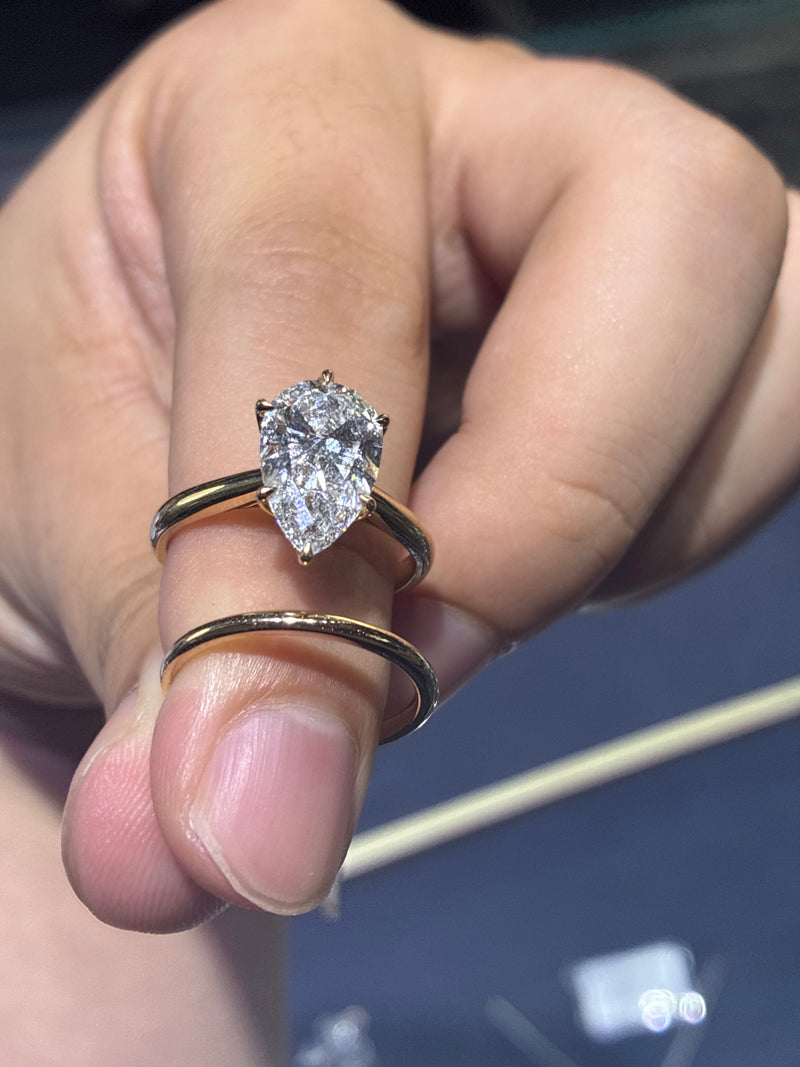 For Elizabeth  a set 14k yellow pear cut 2.89ct D/VVS2 and 14k yellow band