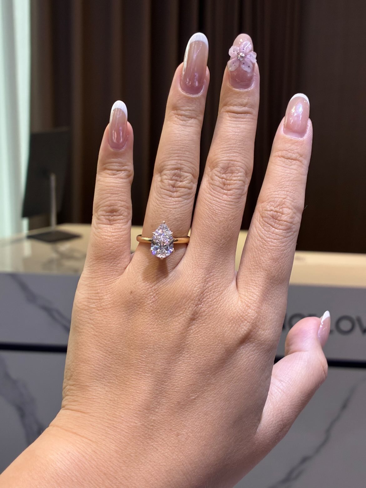 For Kendra, Deposit for 2.5ct pear-shaped diamond (D/VVS2), add diamonds on the bridge with a hidden halo, size 7, in 14K solid yellow gold
