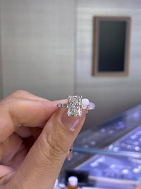 For baybee, 3ct Radiant mainstone with 0.514ct marquis sidestones, E/VVS2, in 14k white gold