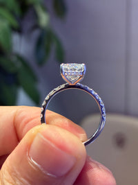 For Risse 3.03 carats E/VS1 radiant with 0.560 carats sidestones in 14k white gold