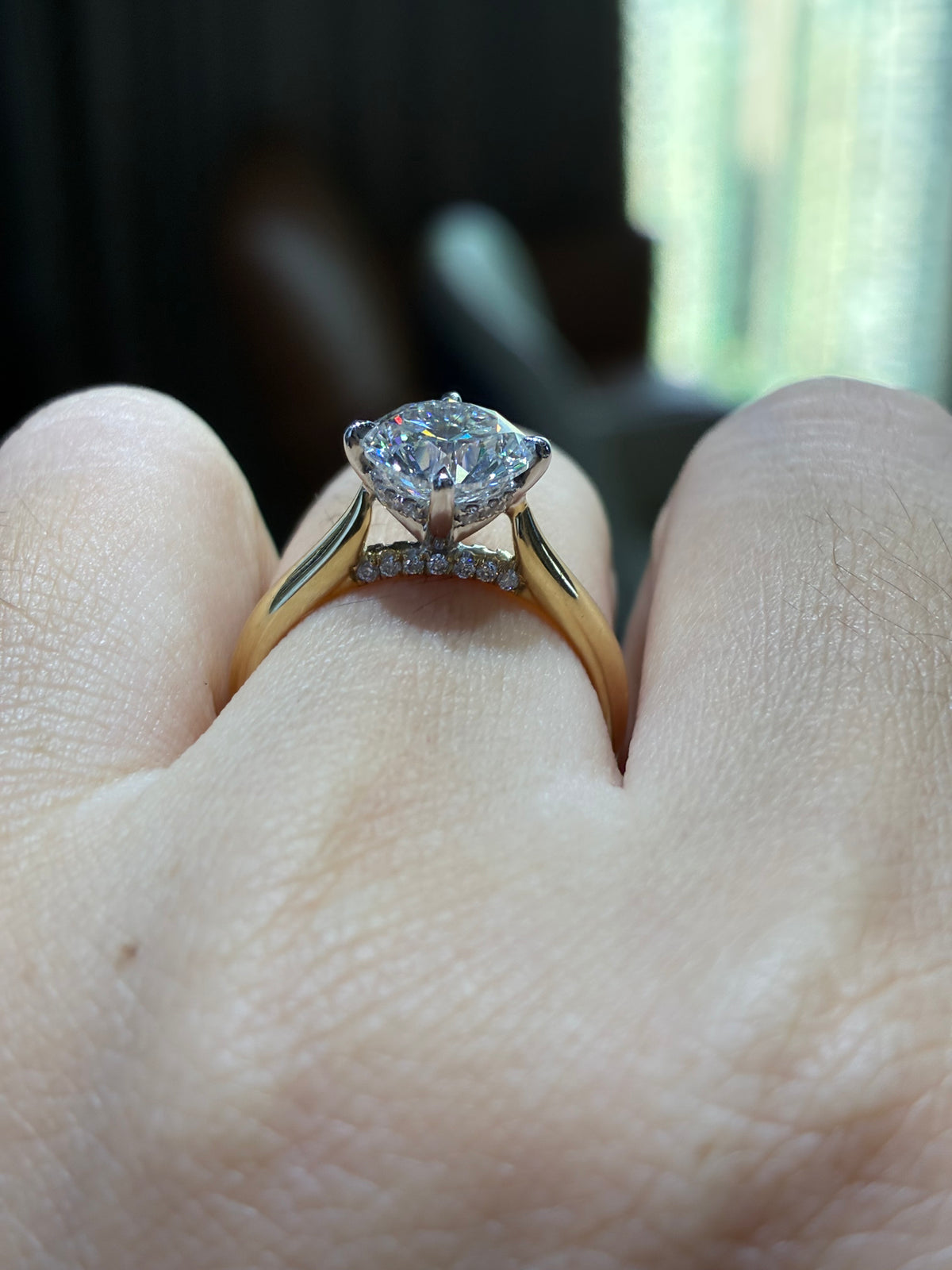 For Natia, custom 14K Gold 1.5ct Round Two tone cathedral setting with diamond on bridge, half pave band, compass prongs, E/VS1