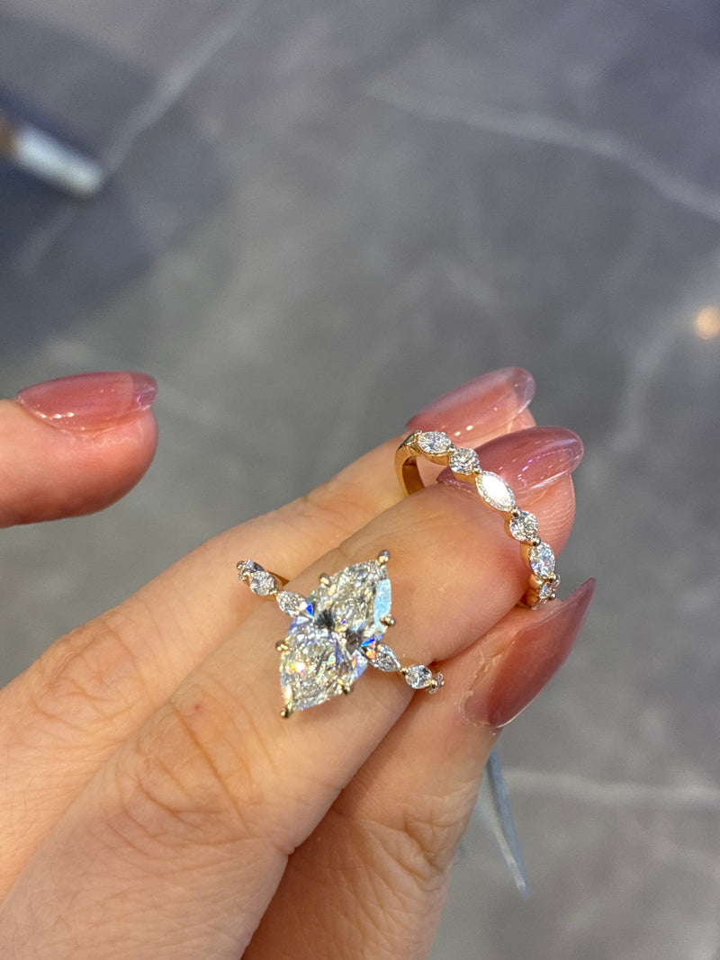 for Cynthia 14k yellow gold 2.5 marquise E/vvs2 with 0.451ct side stones with band 14k yellow gold round and marquise cut 0.409ct/4p