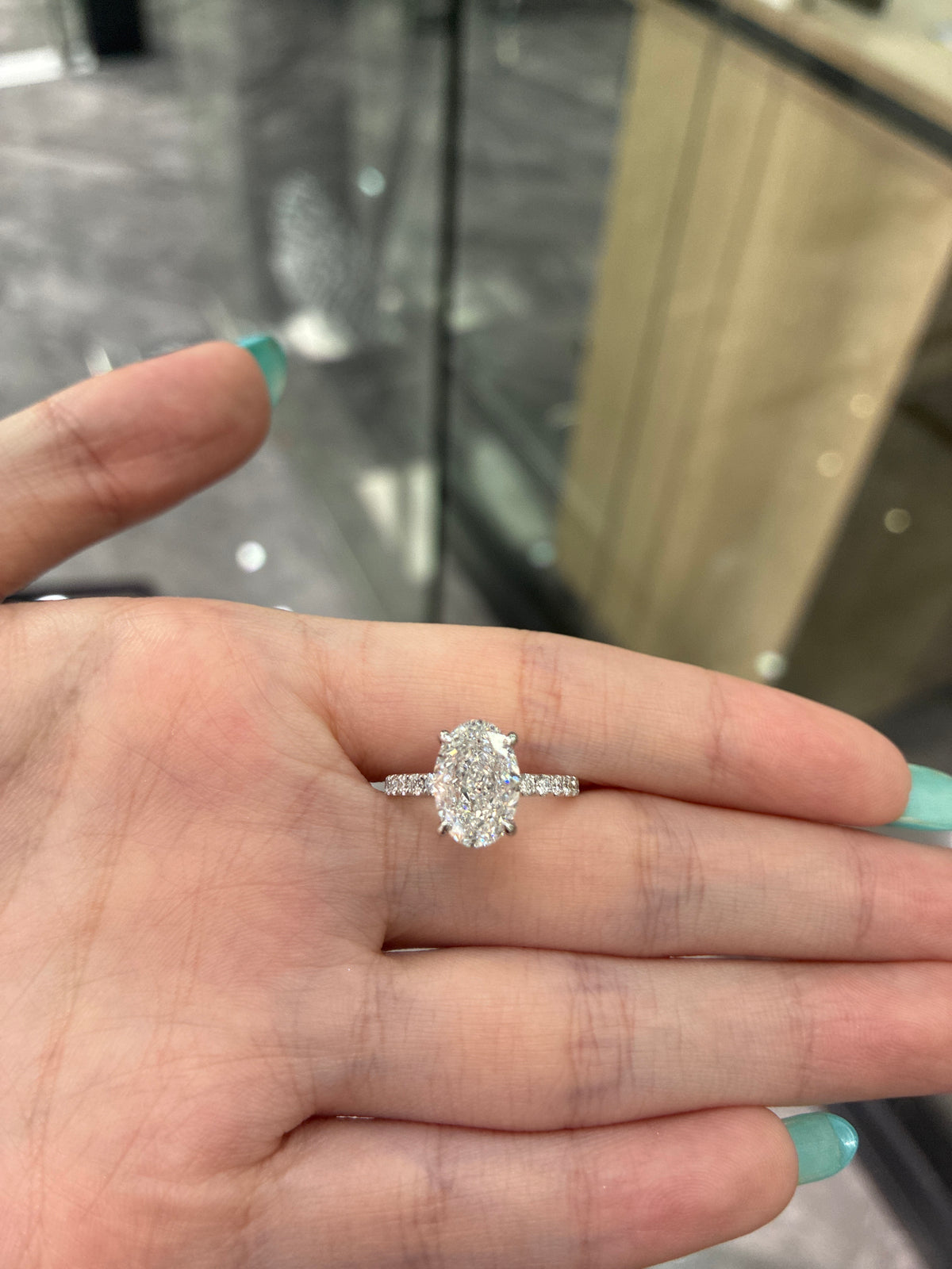 For Megan IVancin 18K white gold 3.10ct oval DVS1 with 0.345 side stones