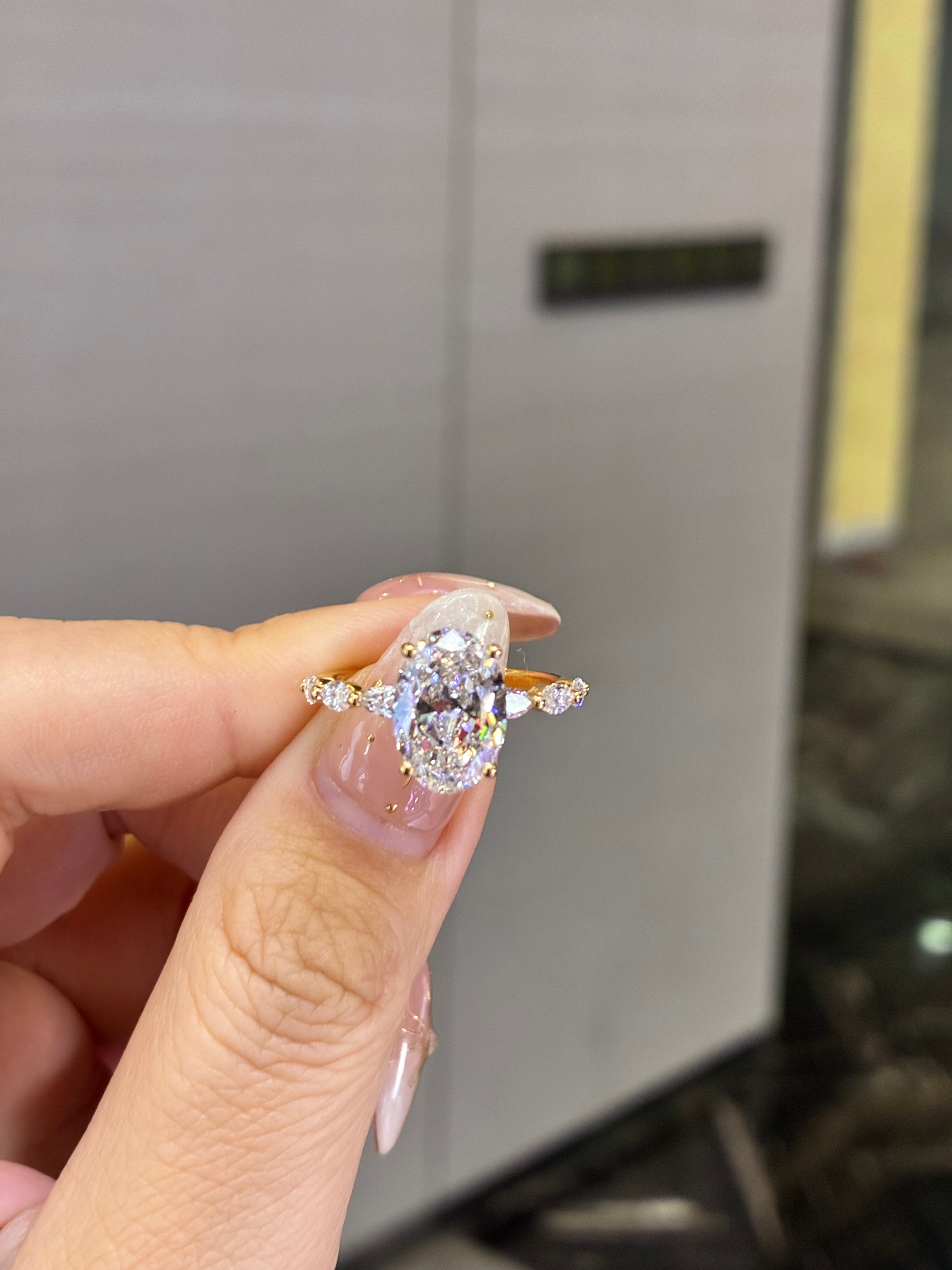 For Luz, 3ct Oval Solitaire with 0.625ct Marquis sidestones in 18k gold
