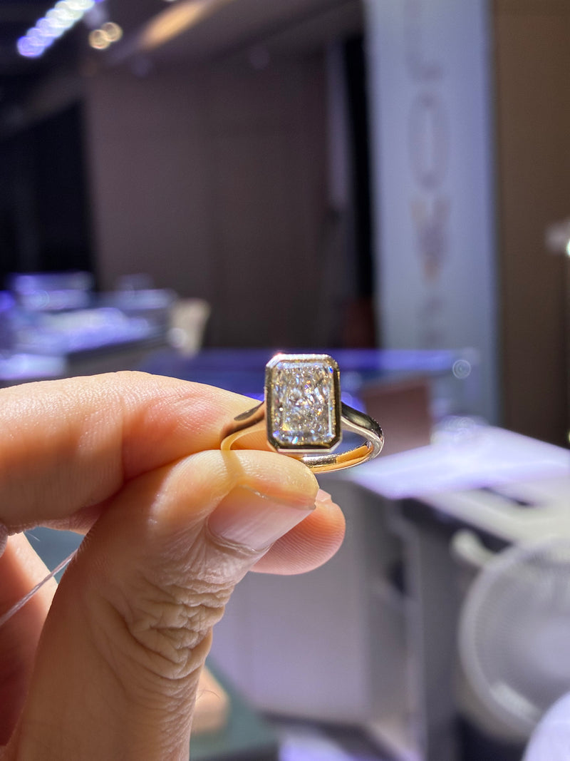 For Shelby 2.62 carats D/VVS2 radiant bezel in 14k yellow gold