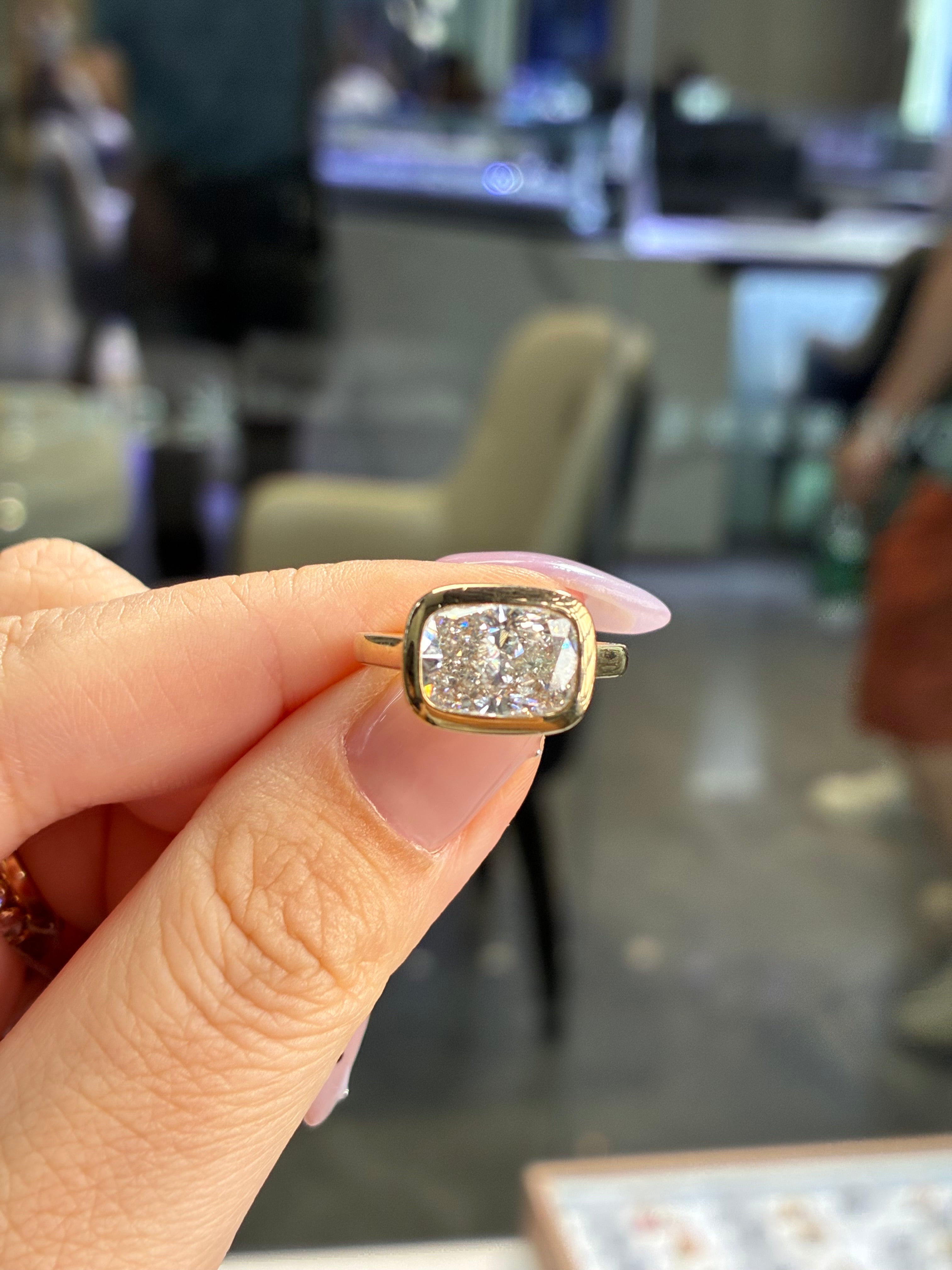 For Jay, 3ct Radiant bezel engagement ring, E/VS1, in 14k yellow gold