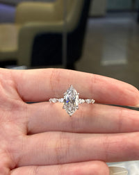 Deposit for Rahma platnium setting 2.5ct marquise ring with 0.4ct side stones, + platnium band with 0.6ct marquis diamond