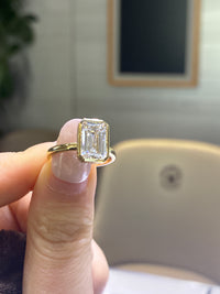 For sam 14k bezel emerald cut ring E/vs1  total 3.178