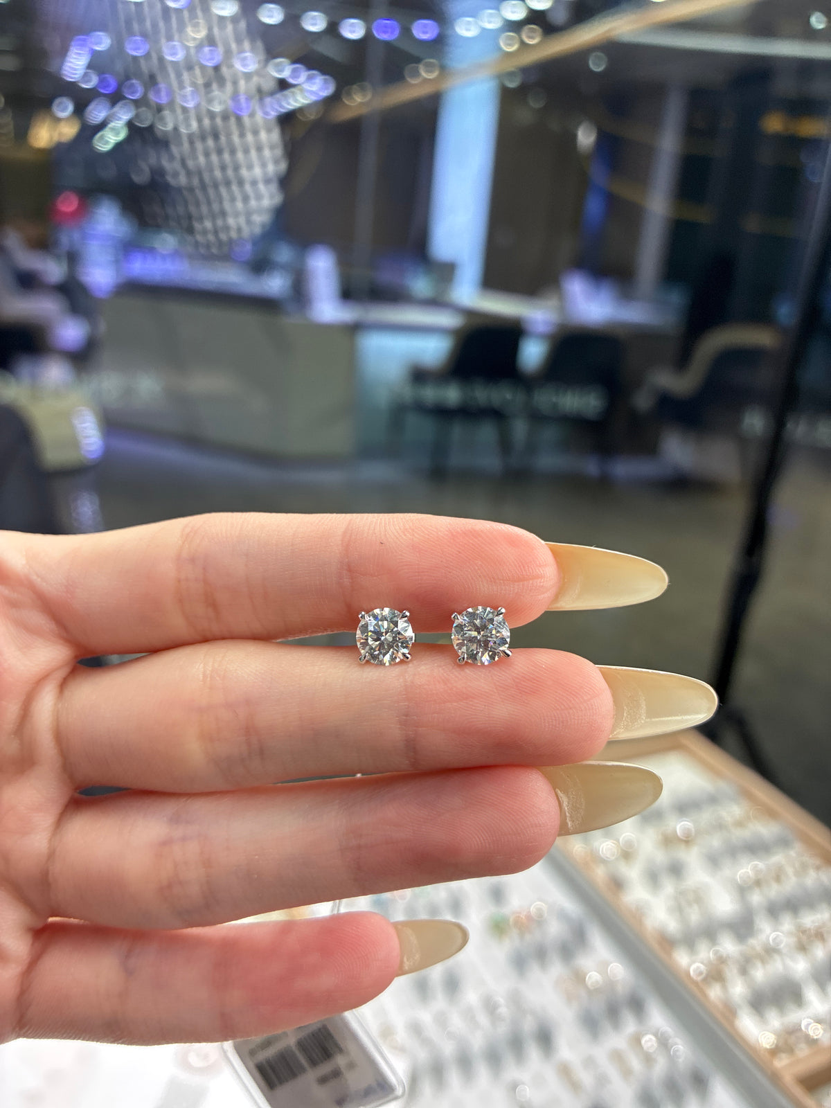 Deposit for Kathy 14k solid white gold 1carat each total 2carat earrings. E/VVS2