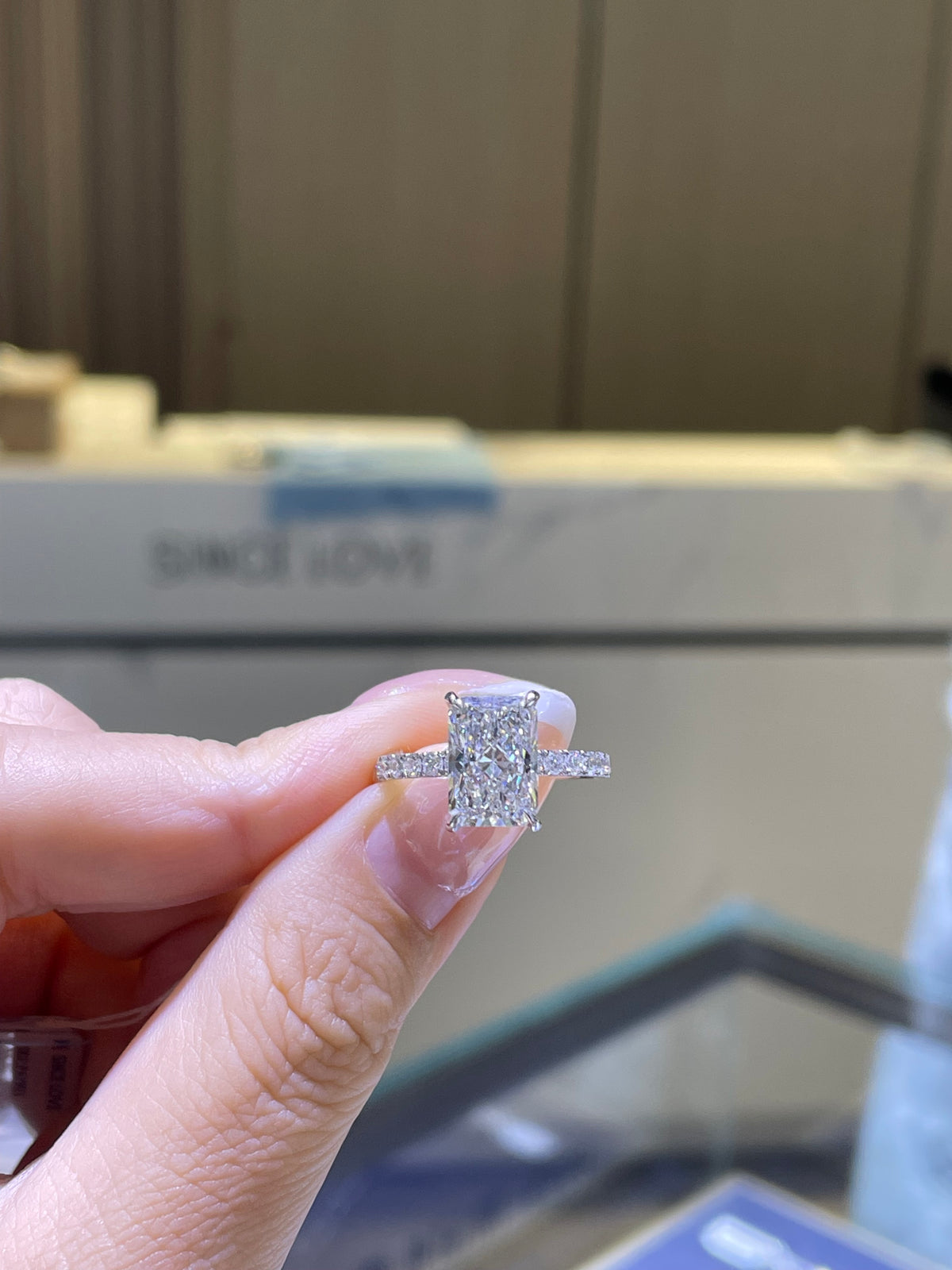 For minikins, 3.03ct Radiant Mainstone with 0.56ct sidestones, E/VS1, 14K White Gold