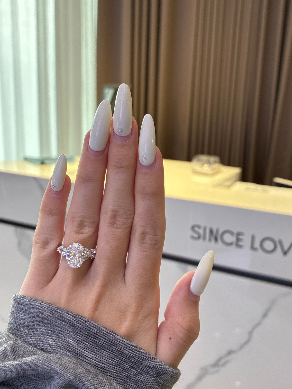 For ElevatedLux, 14k white gold setting only, designed to fit a 4ct radiant loose diamond, the side stones total 0.9ct. All the side stones are D–E color with VS–VVS clarity