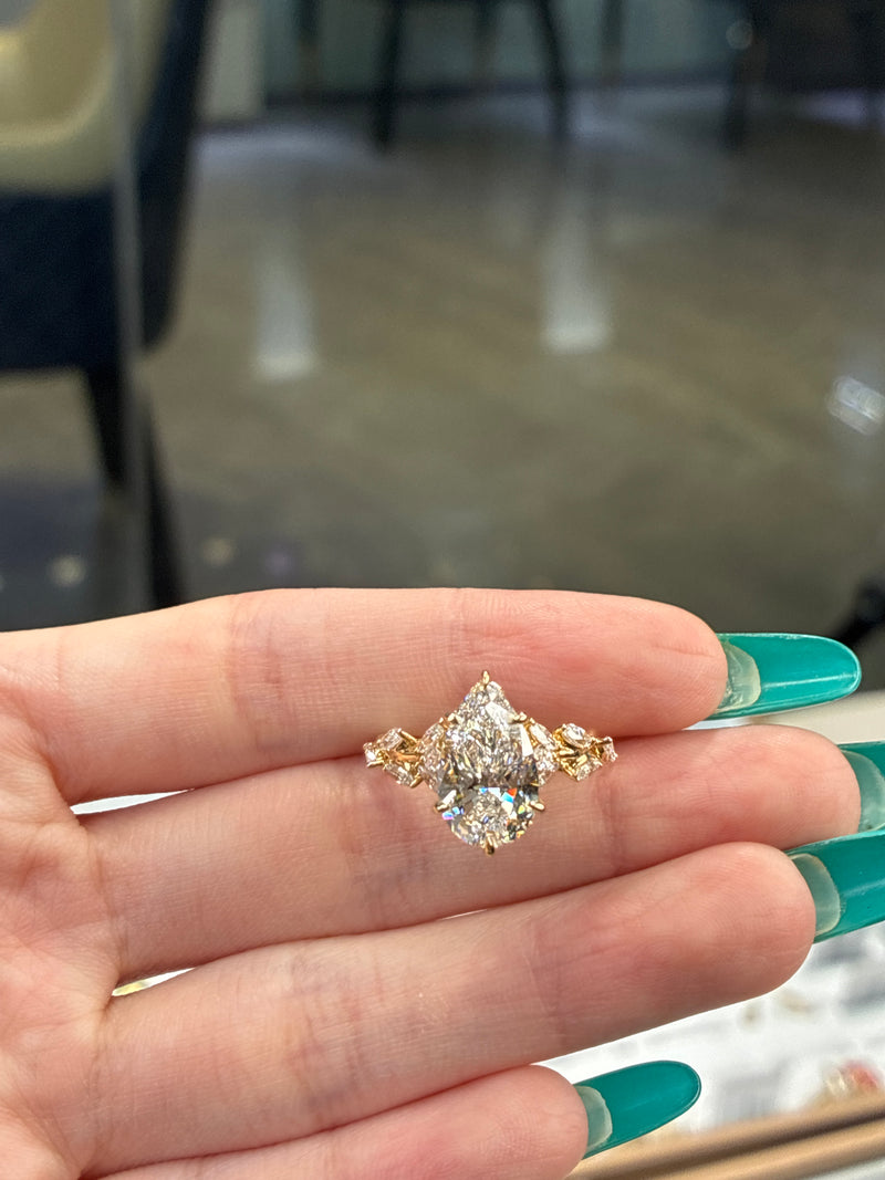 For Eulamae Tenison 14K solid yellow 3.06ct pear E/VS1 with 1.009ct side stones