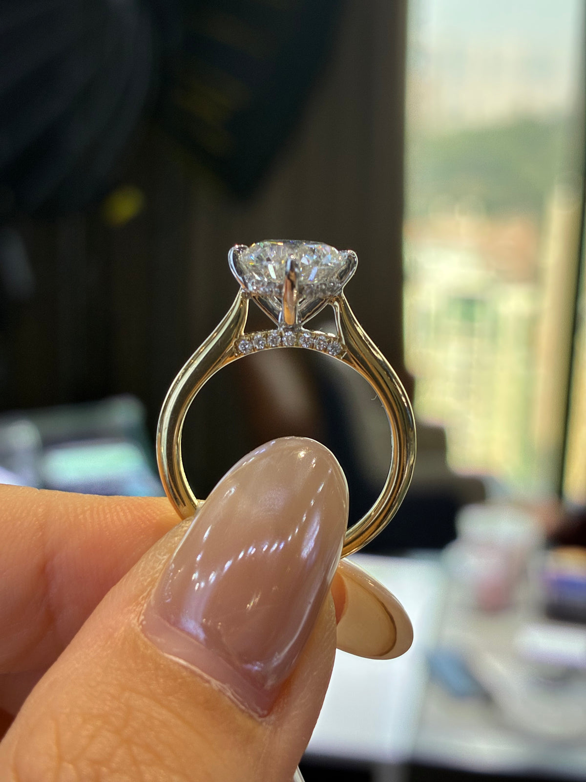 For Natia, custom 14K Gold 1.5ct Round Two tone cathedral setting with diamond on bridge, half pave band, compass prongs, E/VS1