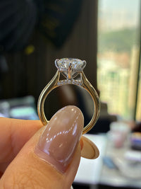 For Natia, custom 14K Gold 1.5ct Round Two tone cathedral setting with diamond on bridge, half pave band, compass prongs, E/VS1