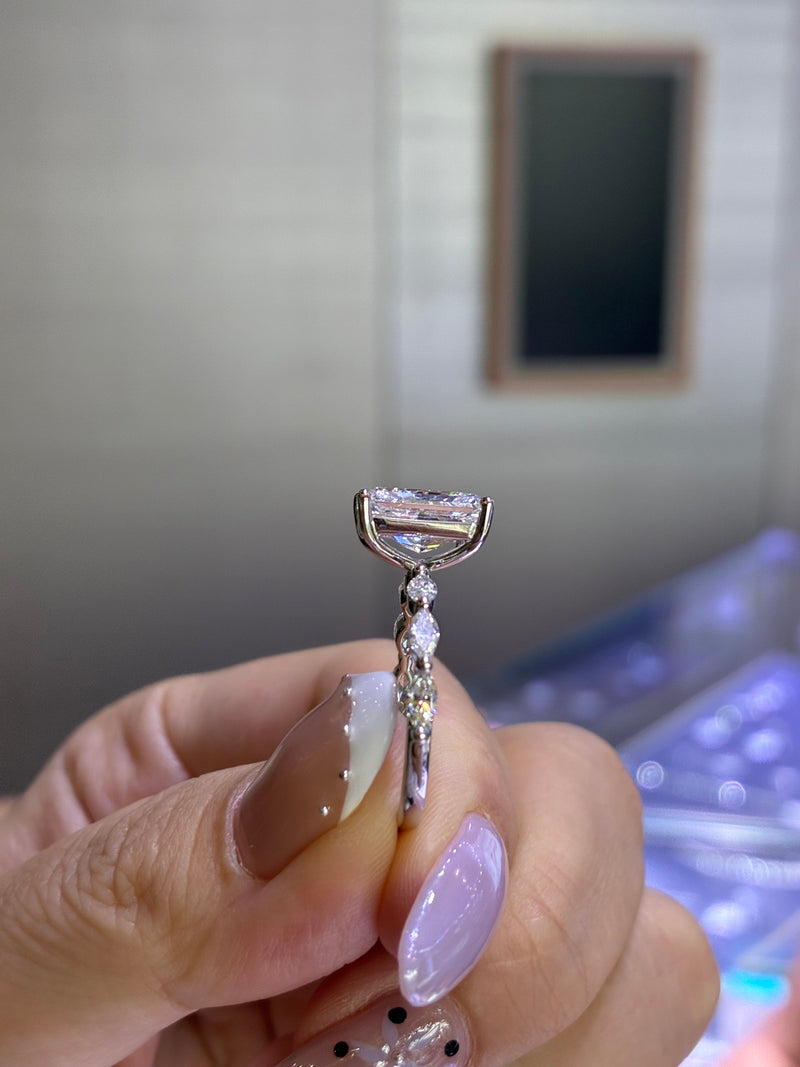 For baybee, 3ct Radiant mainstone with 0.514ct marquis sidestones, E/VVS2, in 14k white gold