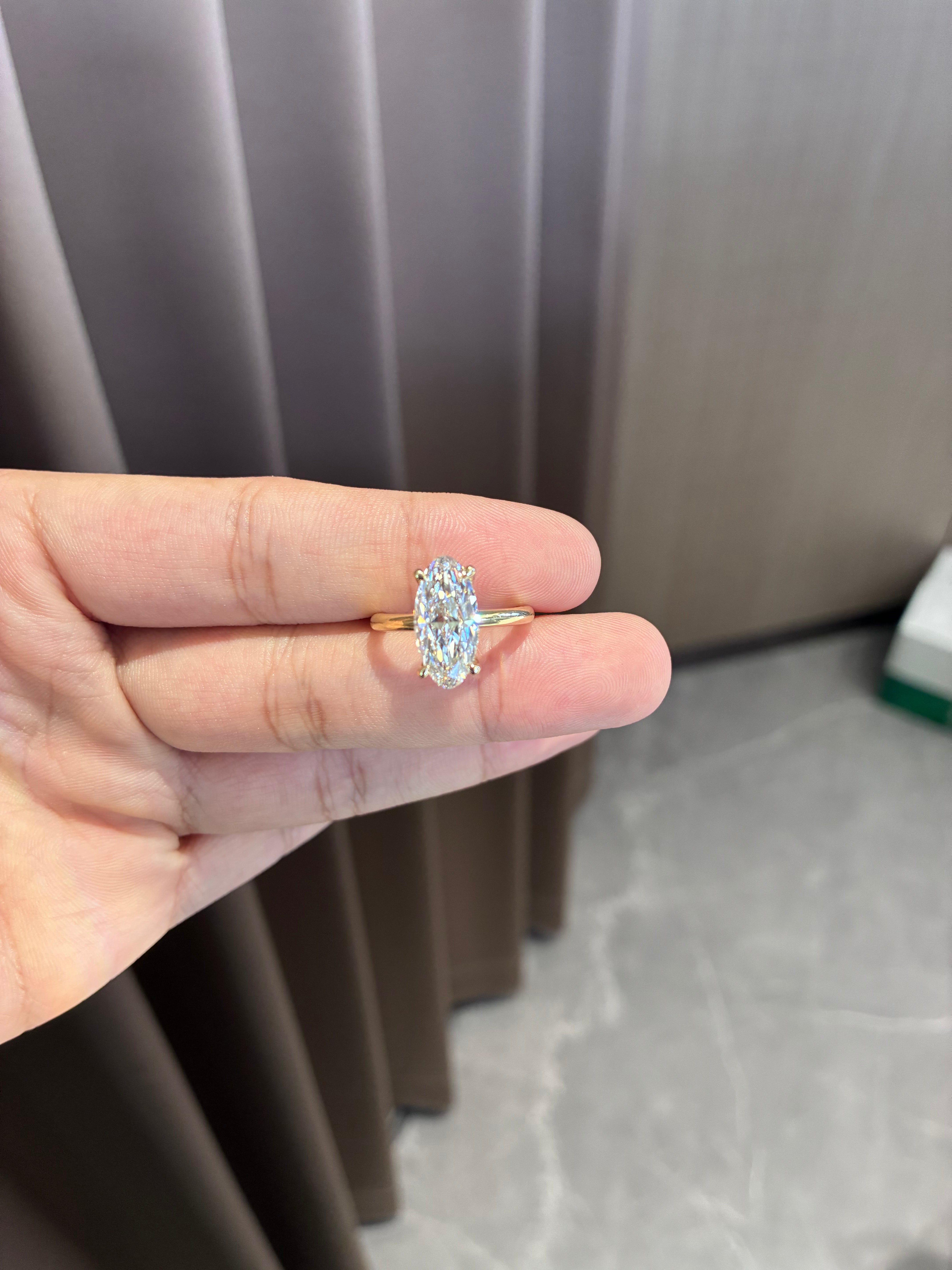For Jesser 14k yellow gold ring with 3ct moval diamond And 0.331ct side stone