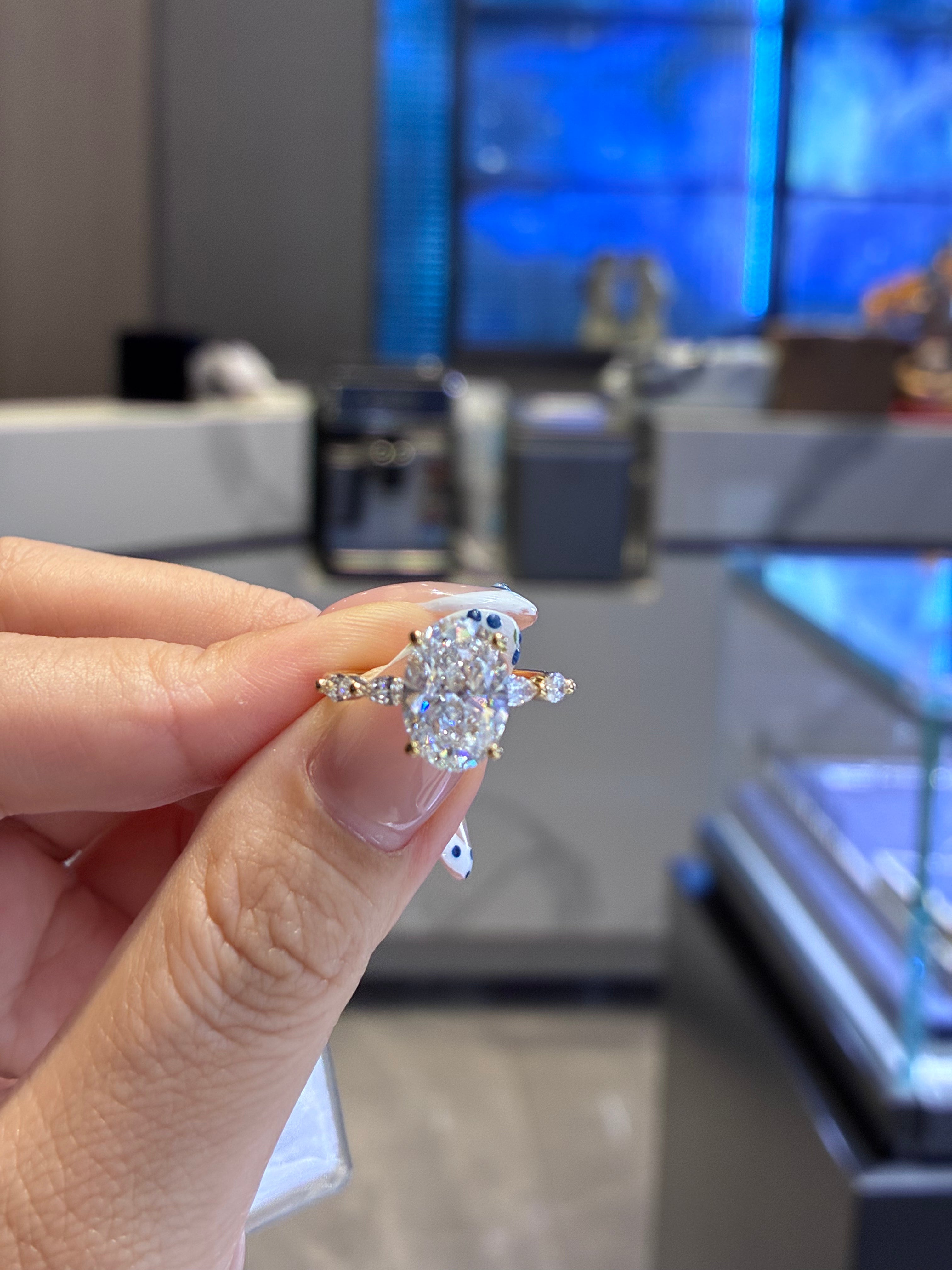 For Karina, 3.1ct oval with 0.48ct sidestones, D/VS1, 18K yellow gold