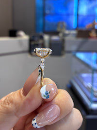 For Karina, 3.1ct oval with 0.48ct sidestones, D/VS1, 18K yellow gold
