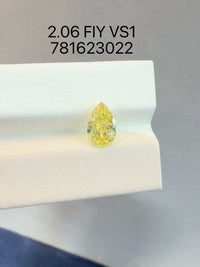 Adding hidden halo For Tammy Sholes230 14k white gold 3stone ring with 2ct pear cut yellow diamond